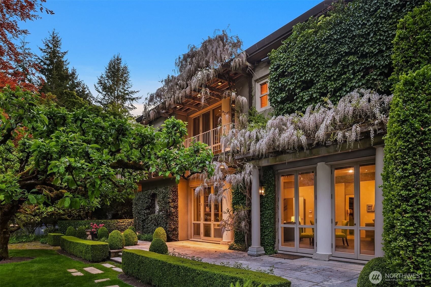 Rare architectural Estate on 3.67 acres. The Roland Terry masterpiece, built by Schultz Miller, is a Contemporary Villa of sophistication & scale. Timeless NW modernism w beamed ceilings, Venetian plaster walls, imported walnut doors & floor-to-ceiling windows create a sense of quiet grandeur. The grand kitchen/gathering room, perfect for everyday living w secondary kitchen. Dining room w hand-painted walls. Light-filled bedrooms w private terraces. Primary features fireplace, vast dressing room & dual baths. Paneled media room, rec room, guest suite, soundproof climate-controlled office, sauna, custom vault & wine cellar. Lush gardens by acclaimed designer Penelope Hobhouse create a truly artful estate. 6-car garage, orchard & keepers shop