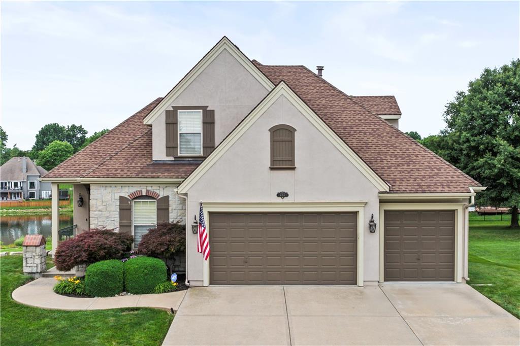 Welcome to a beautiful All Stucco 1.5 Story Home backing to Pond with Fountain and Greenspace in sought out after Raintree Lake!  Location on Picturesque Lot backing to Duck Pond, Curb Appeal, and abundance of Natural Light with Huge Window Package, & Fabulous Trim Package are just some of the initial highlights of this Move-in Ready Home.  Walk into Soaring Ceilings with an Open Floorpan with a spacious Great Room, Study, Breakfast Room, Kitchen, Master Bedroom, Laundry Room and Powder bath...all on the main floor; with all living spaces offered on Wood Floors.  Natural Light could not be better with a Huge Window Package with floor to ceiling windows; all looking out to picturesque views with greenspace, walking trails and Pond.  The covered Deck is a favorite to take in the beautiful environment.  The Kitchen offers a Huge Island with Custom Cabinets and large Pantry which opens to the Breakfast Room and Great Room with Fireplace.  The Master Bedroom will not disappoint with High Ceilings, Fireplace, and Floor to Ceiling Windows. Upstairs find a lovely Loft Area perfect for a study or media space, as well as 2 Bedrooms and Bath. Closet space will not be a problem as all bedrooms offer spacious storage. The Walkout Lower Level is an Entertainment Mecca with a Large Family Room, Game Area, 2 more Bedrooms and Bathroom leading out to a covered Patio. Here is your chance to live at Raintree Lake in a truly Custom Home where you can Ski, Wakeboard, Fish, or just enjoy the views and lifestyle at Raintree Lake.  Your year round vacation home awaits in the resort style location of Raintree where amenities make all the difference!