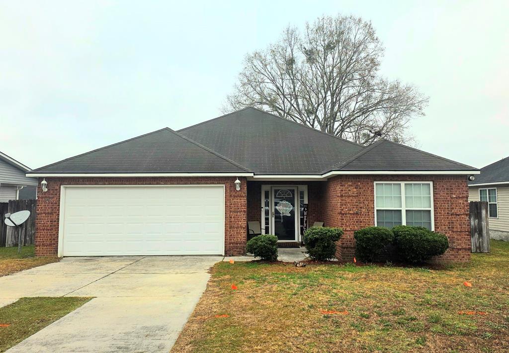 This charming 3-bedroom, 2-bathroom brick home in the desirable Grove Pointe neighborhood is exactly what you have been looking for. The open-concept layout creates a light and airy atmosphere, complemented by a spacious living room featuring a trey ceiling.  The home offers a split floor plan for added privacy, with the primary bedroom including a tub/shower combo and a walk in closet.  The functional galley-style kitchen and dining area make meal preparation a breeze. Additional features include a double car garage and a fenced backyard, perfect for family gatherings and pets.   Located near Cassidy Park, you will have easy access to fishing, relaxing, and outdoor activities. Don't let this opportunity pass you by—contact your realtor today to schedule a viewing.