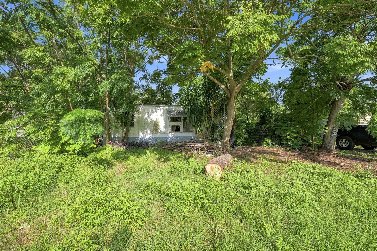 Unlock the potential of this 2-bedroom, 1-bath manufactured home situated on a 0.07-acre lot in Hudson. Offering a functional floor plan with a spacious living room, dedicated dining area, enclosed sun room, and two comfortably sized bedrooms, this property presents an excellent opportunity for a complete renovation or investment project. Large windows throughout fill the interior with natural light, while the enclosed sun room provides additional flexible living space overlooking the yard. The existing kitchen and bathroom layouts offer a great starting point for creating a customized design, and the open living and dining areas provide a layout well suited for modern updates. Whether you're an investor, contractor, or buyer looking to create a personalized residence, vacation retreat, rental property, or seasonal getaway, this home is ready for your vision and creativity. Conveniently located near shopping, dining, medical facilities, schools, Hudson Beach, marinas, and the Suncoast Parkway, you'll enjoy easy access to waterfront restaurants, boating, fishing, Gulf Coast sunsets, and an easy commute to Tampa and surrounding areas. With renovation potential, a practical layout, and a desirable location close to everyday conveniences and coastal attractions, this property offers an outstanding opportunity to add value and make it your own.