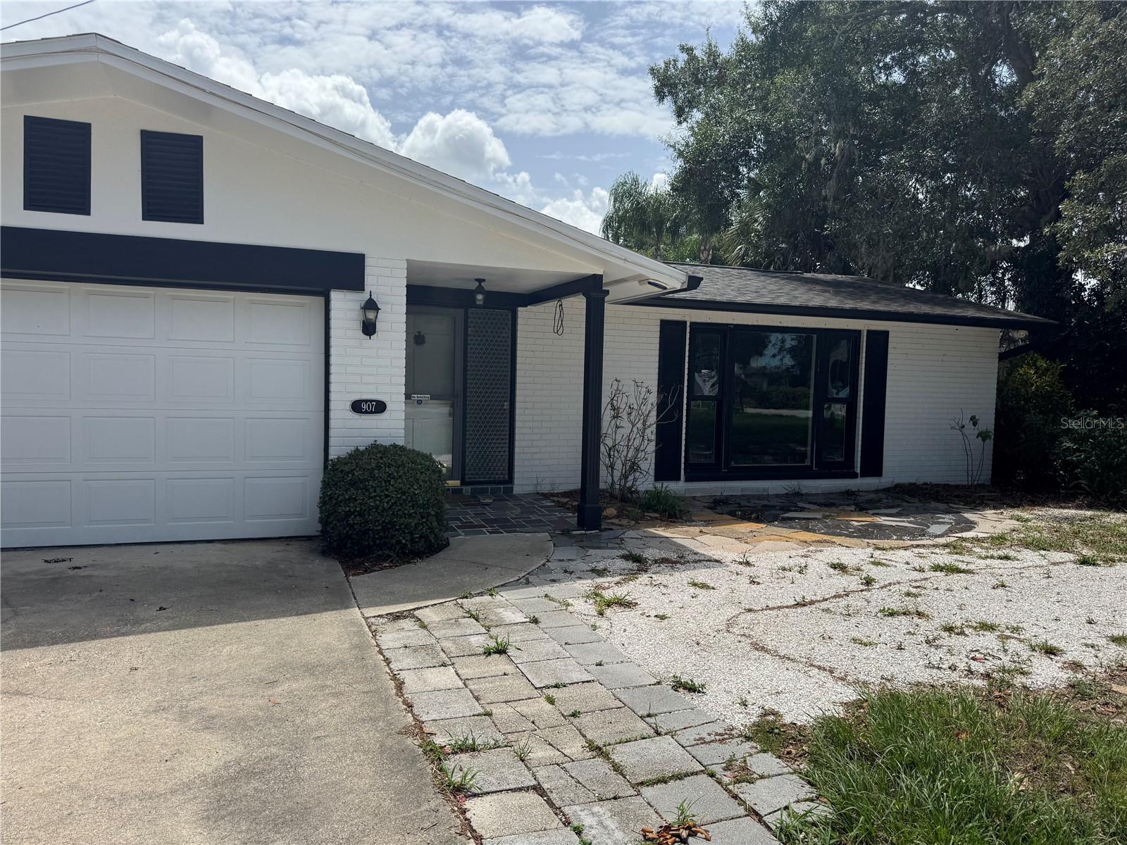 Short Sale. This 4-bedroom, 2-bath home with a 2-car garage is ideally located in beautiful Tarpon Springs with no HOA or CDD fees. Situated on an oversized, fenced lot with a 12-foot gate, there's plenty of room to park your boat, RV, or other recreational vehicles. The heated in-ground pool and spacious backyard create the perfect setting for relaxing or entertaining, while the detached workshop with electricity offers excellent space for hobbies, storage, or a home workspace.Inside, you'll find a functional floor plan with generous living space, including an enclosed 300+ square foot porch with direct access to the pool and bathroom. Large bay windows in the living room provide beautiful sunset views, and the home's flexible layout allows you to separate living areas for added privacy. The windows and pool heater were replaced in 2017.