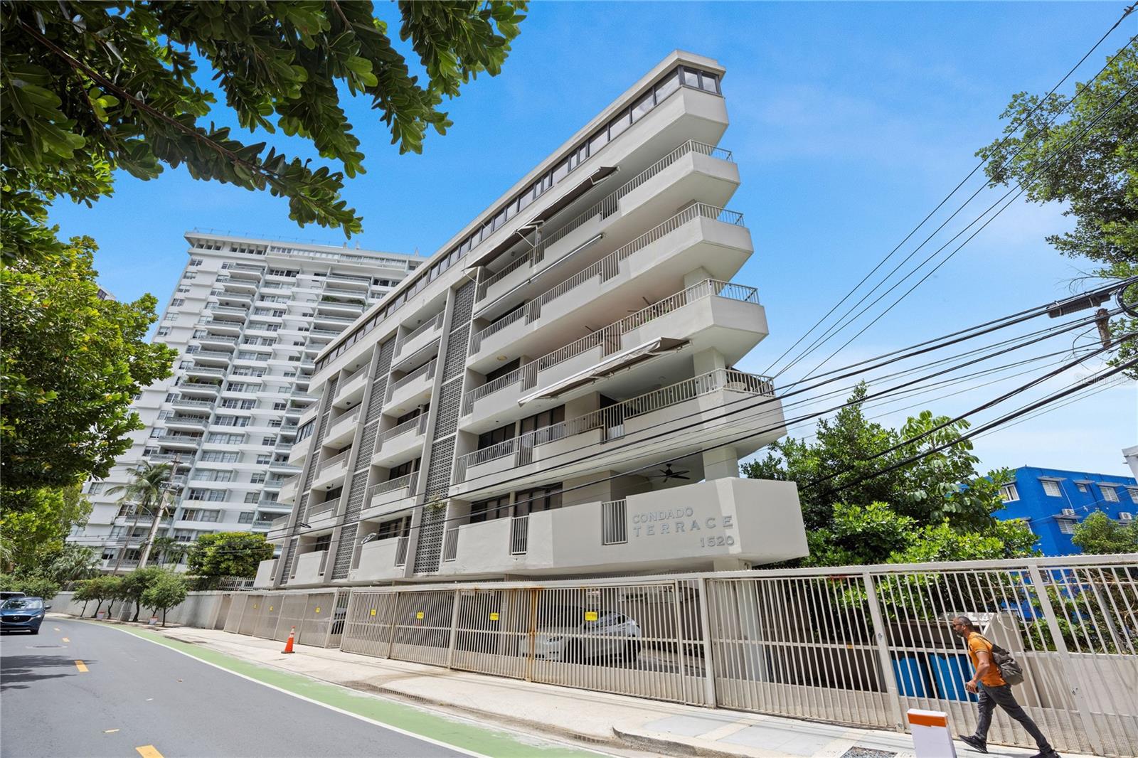 Positioned along iconic Ashford Avenue at Condado Terrace, this residence offers a rare balance of vibrant city living and a relaxed beachfront lifestyle. Ideally located between Condado and Ocean Park, it sits within one of San Juan’s most desirable coastal corridors. Just across the street, miles of uninterrupted sandy beach set the tone for daily walks, ocean swims, and effortless access to the water.The residence enjoys an ocean view from a beautiful terrace and a seamless indoor-outdoor flow. Spanning approximately 3,060 square feet, the apartment features an open-concept living, kitchen, and dining area, along with 3 bedrooms and 3.5 bathrooms. The layout is thoughtfully distributed to maximize comfort and privacy. A private terrace extends the living space and includes a BBQ area, creating an inviting setting for outdoor dining and entertaining. The full kitchen is equipped with a refrigerator, dishwasher, stovetop, and a versatile oven suite including both conventional and microwave/convection options. Additional features include a washer and dryer, 5 inverter A/C units, and 6 ceiling fans.The home is supported by a water cistern and a full backup generator with an oversized 600-gallon fuel tank that powers the entire apartment. This full-floor residence includes 2 covered parking spaces and offers a level of privacy that is increasingly rare. The property is offered unfurnished, and all artwork and personal items will be removed prior to closing.Condado Terrace, built in 1965, is a boutique six-floor condominium that reflects the mid-century transformation of Ashford Avenue into San Juan’s “Golden Strip.” Designed in a tropical modern style, the building emphasizes cross-ventilation and indoor-outdoor living. The triangle-shaped structure utilizes reinforced concrete, providing durability against the coastal environment. With only nine residences in total, it offers a private, low-density alternative to larger towers. This is a premier opportunity for a primary residence, second home, or investment in a prime Ashford Avenue location.
