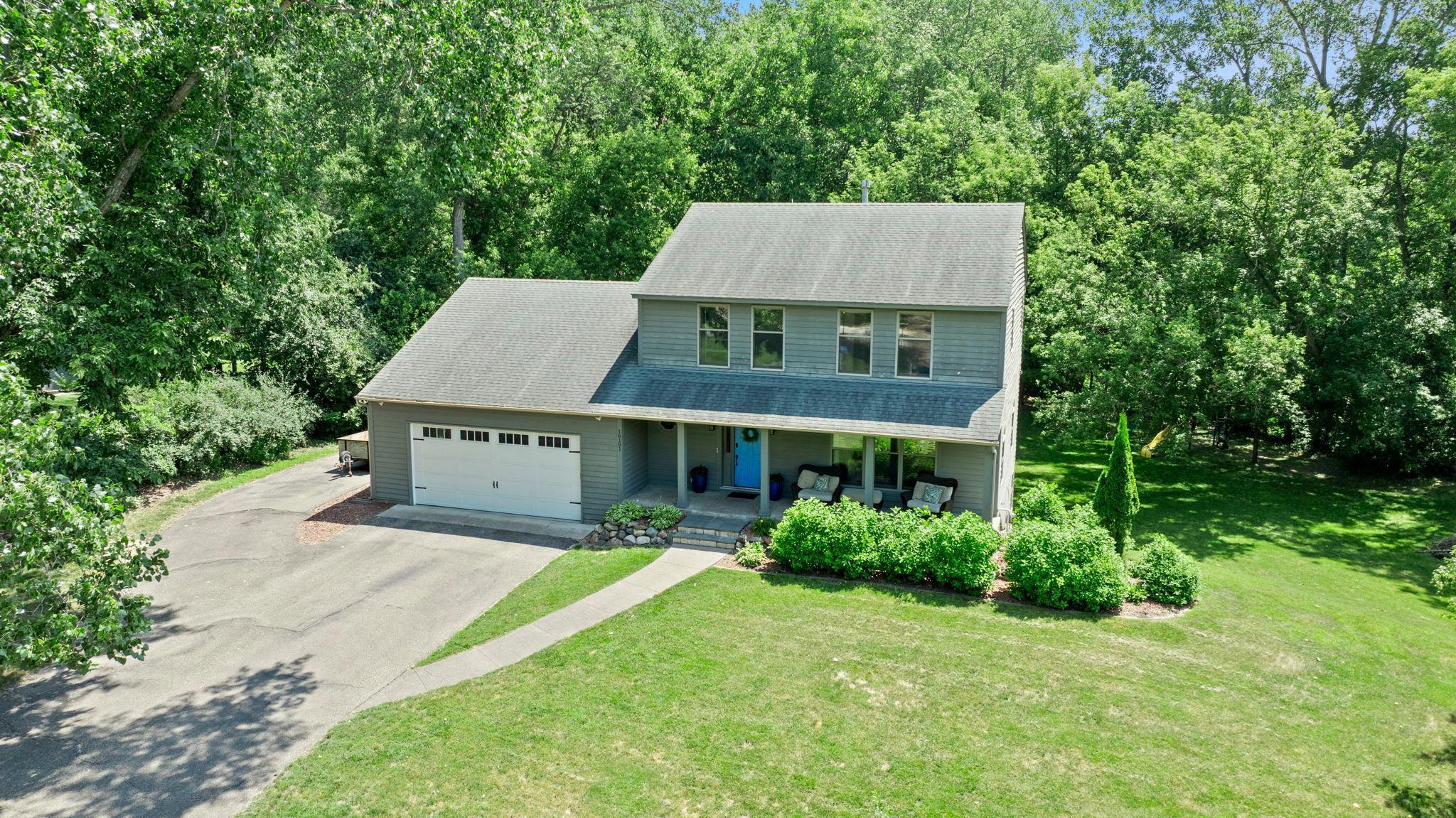 Stunning 3BR, 3BA home nestled in a peaceful, tree-lined neighborhood near scenic Purgatory Creek and Boulder Creek Park. Ideally located in Minnetonka School District, near Scenic Heights Elementary, and just minutes from shopping, dining, and conveniences, this home offers a perfect balance of tranquility and accessibility.

Step into a sun-drenched living room with a grand picture window and rich wood floors that flow into an elegant formal dining room featuring charming arched windows. The chef’s kitchen dazzles with stainless steel appliances, gas cooktop, double wall ovens, center island, built-in desk, and stylish tile backsplash.

Enjoy casual meals and gatherings in the informal dining area that opens to a vaulted-ceiling family room with sliding doors leading to a large maintenance-free deck—ideal for indoor-outdoor living. Main-level laundry includes Maytag washer/dryer and utility sink, plus a tasteful half bath.

Upstairs, the vaulted primary suite boasts dual 5x5 walk-in closets and a spa-inspired en suite with tiled walk-in shower, jetted tub, and double vanity. Two additional spacious bedrooms share a full bath, one with its own walk-in closet.

The unfinished walkout basement offers endless possibilities. Outside, relax on the covered 32x6 front porch or entertain on the expansive 26x12 deck, surrounded by mature trees and immaculate landscaping. Bonus side driveway and attached 2-car garage complete this beautiful, move-in-ready home!