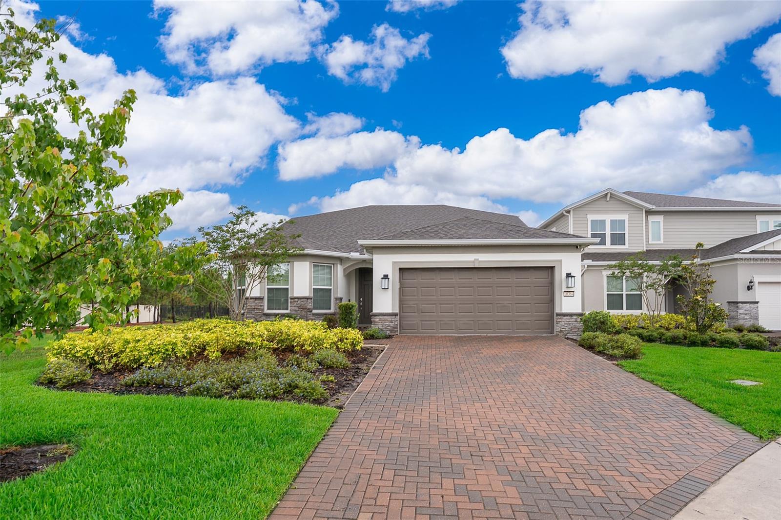 Huge Price Improvement! Motivated sellers! Priced below appraisal price! Welcome to this beautifully upgraded and spacious home located in the highly sought-after gated community of Isles of Lake Nona! This stunning property sits on a premium corner lot with serene water views and boasts over 3,100 square feet of living space, featuring 4 bedrooms, 4 bathrooms, a private office, and a large bonus/game room.
Elegant Upgrades Throughout: Enjoy wood-look tile flooring on the main floor, real wood flooring upstairs, fresh interior paint  and a beautifully designed outdoor kitchen for year-round enjoyment.

Gourmet Kitchen: Perfect for entertaining, the open-concept kitchen features quartz countertops, stainless steel appliances, a natural gas cooktop, walk-in pantry, and a grand center island that flows seamlessly into the spacious family room and dining area.
Luxurious Owner’s Suite: The first-floor owner’s suite offers a private retreat with a spa-like bathroom, dual vanities, and ample closet space.

Outdoor Oasis: Step through expansive sliding glass doors into your backyard haven—complete with no rear neighbors, pond views, and a fully equipped outdoor kitchen ideal for entertaining.
Flexible Living Space: Upstairs features a spacious bonus/game room, perfect for movie nights, plus an additional private bedroom and full bath—ideal for guests or multigenerational living.


Residents of Isles of Lake Nona enjoy world-class amenities including:

24-hour gated security
Resort-style pool and clubhouse
State-of-the-art fitness center
Tennis, pickleball, and basketball courts
Scenic walking trails and more!


Just minutes from Lake Nona Medical City, Orlando International Airport, USTA National Campus, top-rated schools, and major highways (SR 417 & SR 528), offering quick access to shopping, dining, and Orlando’s top attractions.