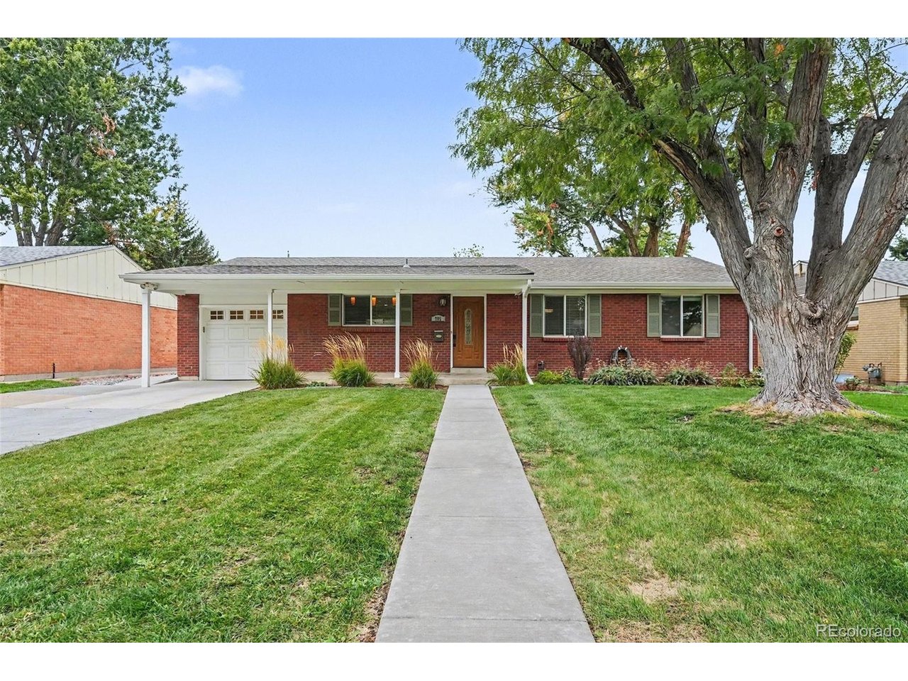 Beautifully updated brick ranch on a quiet Denver street, just steps from the Cherry Creek Trail! This move-in-ready home offers 4 bedrooms, including 2 conforming basement bedrooms, and an extensive list of improvements. Inside, discover gleaming hardwood floors professionally refinished in 2026, fresh interior paint, new carpet, and updated fixtures and hardware throughout. The kitchen and bathrooms were remodeled in 2015, along with updated windows and doors. The finished basement provides additional living space, two conforming bedrooms, and a wet bar with convenient access to the laundry room. Major improvements include a Class IV impact-resistant shingle roof and new gutters (2023), a newer sewer line beneath the basement floor, exterior paint (2024), and a new fence (2026). Additional features include attic insulation, sound-reducing insulation above the basement bedrooms, and front and rear sprinkler systems. Professionally maintained mature trees enhance the outdoor setting. Enjoy easy access to the Cherry Creek Trail, Glendale, shopping and dining along South Colorado Boulevard, Cherry Creek North, I-25, and Downtown Denver. Classic brick-ranch character meets thoughtful updates in a convenient Denver location!