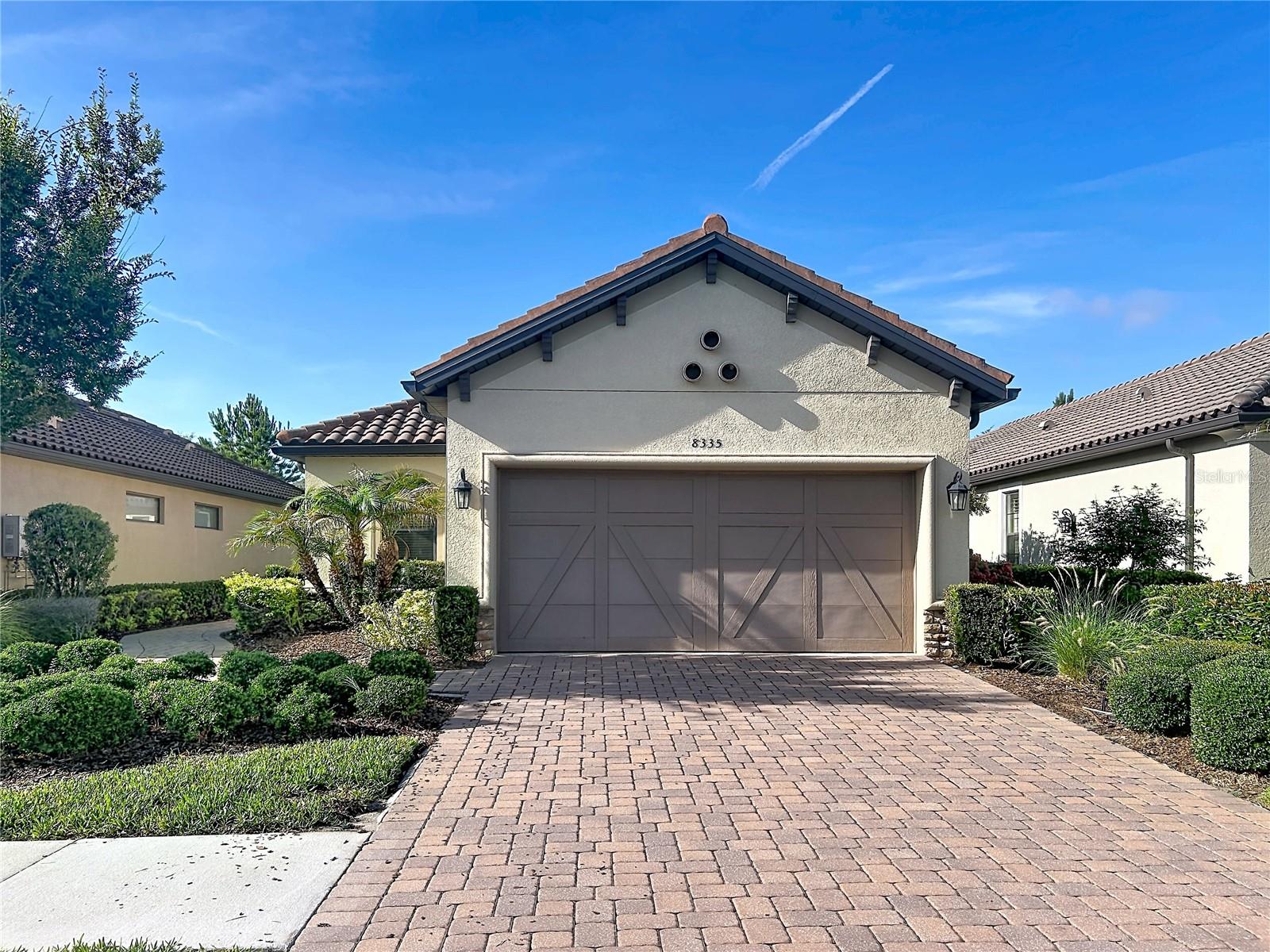 Luxury Living in Esplanade of Tampa – Move-In Ready! Welcome to 8335 Alberata Vista Drive, a beautifully maintained luxury home located in the highly desirable gated community of Esplanade of Tampa. This bright and open 3-bedroom, 2-bathroom residence with a 2-car garage shows like new and offers the perfect blend of comfort, style, and low-maintenance living. HOA maintains landscaping for added convenience.The gourmet kitchen features stainless steel appliances, a gas range, Corian countertops, abundant cabinetry, a breakfast bar, and a spacious pantry. The open-concept living area is ideal for entertaining and seamlessly connects to the outdoors, overlooking an extended 16' x 16' screened lanai and a private backyard retreat.There is no carpet anywhere in the home, offering a clean, modern, and low-maintenance living environment.Residents of Esplanade of Tampa enjoy an impressive lineup of resort-style amenities, including a resort-style pool with cabanas, clubhouse, fitness center, tennis and pickleball courts, two dog parks, fire pit, community mailboxes.The entire neighborhood showcases beautiful Mediterranean-style architecture, featuring paver driveways and tile roofs throughout, creating a cohesive and upscale community aesthetic.Centrally located with convenient access to I-75, I-275, and Bruce B. Downs Boulevard, the home is just minutes from premier destinations including Wiregrass Mall, The Grove, Tampa Premium Outlets, KRATE Micro Shops, and PopStroke, as well as major medical facilities. Everyday conveniences are nearby, including Target, Publix, Walmart, World Market, and ALDI, with Whole Foods coming soon in the area.
