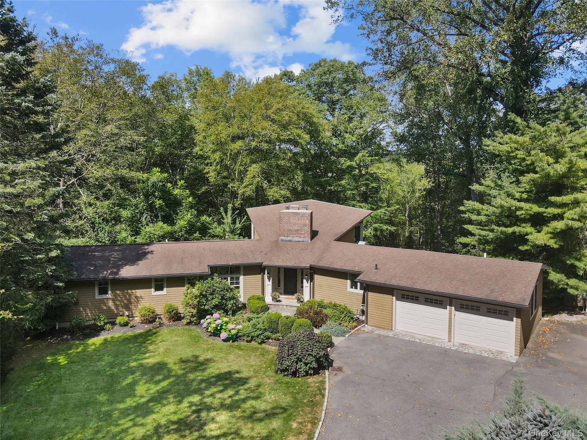 Welcome to this inviting 3-bedroom, 3-bathroom renovated ranch-style home in the heart of Yale Farms, one of Armonk’s most sought-after neighborhoods. Perfectly set on over 2 acres with serene surroundings, this residence blends comfort, style, and convenience for today’s lifestyle.

Step inside to discover a bright and open layout designed for both everyday living and entertaining. The great room is the centerpiece of the home, with vaulted ceilings and floor-to-ceiling windows framing beautiful natural views year-round.

The eat-in kitchen features top-of-the-line Viking and Bosch appliances and flows seamlessly to the dining area for gatherings large or small, while hardwood floors throughout add warmth and timeless appeal. The main level includes the primary bedroom suite with the primary bathroom and a walk-in closet and two additional generously sized bedrooms, and two full bathrooms.

Downstairs, the lower level offers a family room with a fireplace and French doors opening to the yard, along with flexible finished space ideal for a home office, or playroom—tailored to your needs. Located on a quiet cul-de-sac, the spacious property is complete with an electric dog fence.

Set in prestigious Yale Farms, this home enjoys a premier location just minutes from Armonk’s vibrant downtown, top-rated Byram Hills schools, and major highways. With Greenwich only 15 minutes away and New York City less than an hour away, the convenience is unmatched.

If you’re looking for a move-in-ready home, 4 Yale Place is a rare opportunity in one of Westchester’s most desirable communities.
