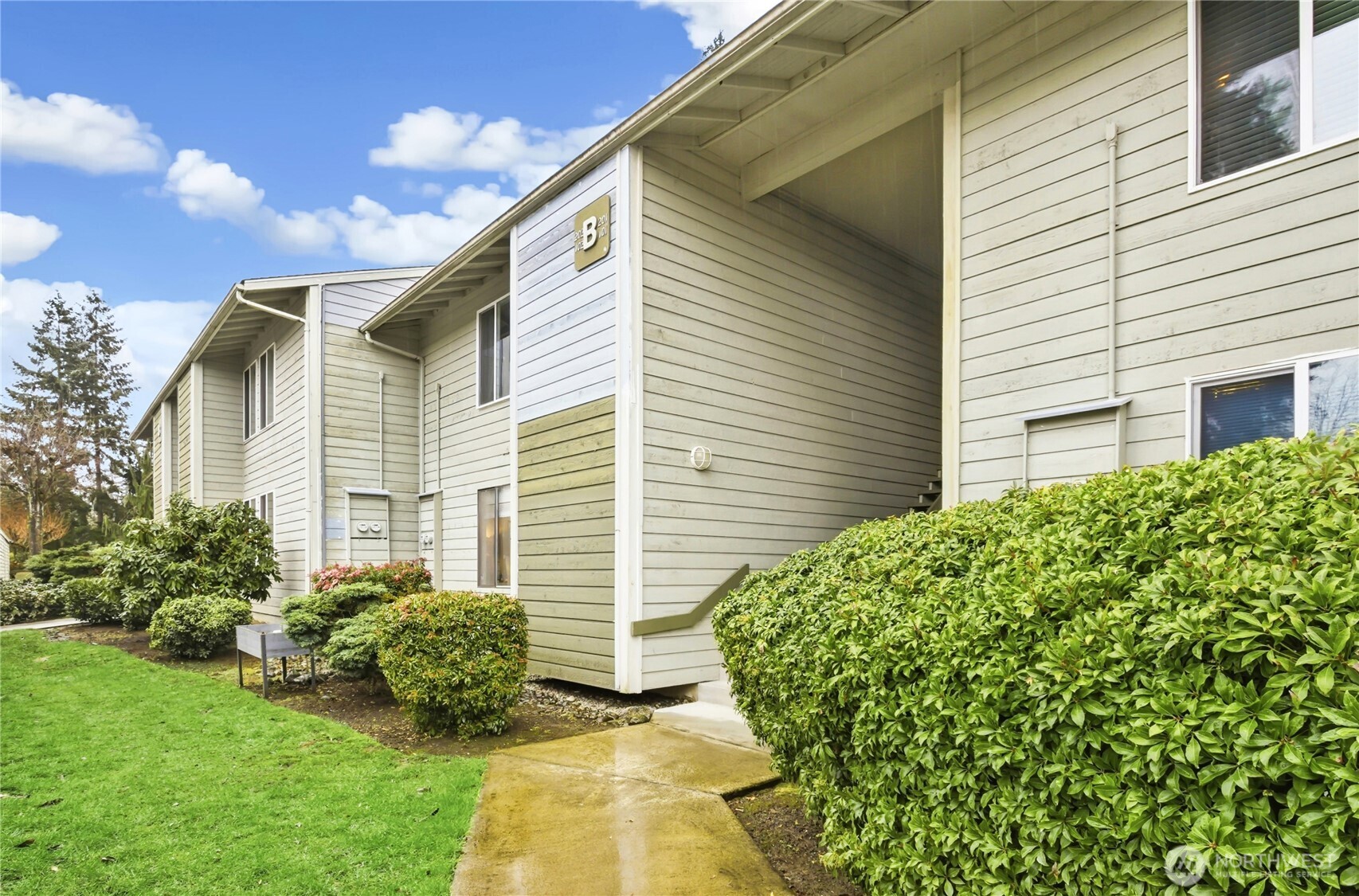 Modern Elegance – Your Ground-Floor Oasis. Experience the perfect blend of modern comfort and effortless living in this stunning, refreshed & remodeled 2-bedroom, 2-bathroom condo. Situated on the ground floor for easy access, this home greets you with brand-new LVP flooring and a crisp, fresh interior paint. The primary bedroom is spacious with its own bath and closet. The second bedroom is generous. The main bathroom with quartz countertops and new floors and lights. Kitchen with elegant granite countertops and a streamlined layout that flows seamlessly into the laundry area. The heart of the home is an open-concept living area, where a cozy wood-burning fireplace serves as the perfect centerpiece. The sliding door opens to the back porch perfect for relaxation and coffee/tea. The water heater is newer 2021. 1 covered parking space is assigned to the unit with a storage room. Community also has outdoor swimming pool, clubhouse & ample guests parking. No rental cap and no special assessment. Convenient location near grocery stores, restaurants and golf courses.