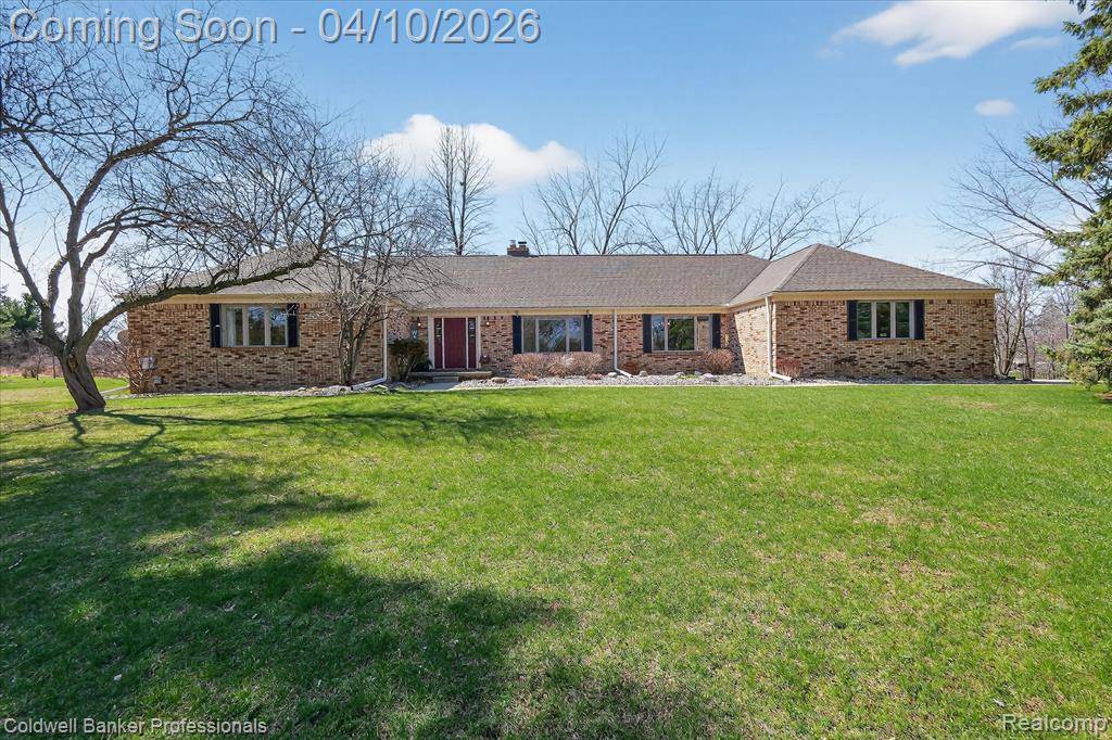 Experience peaceful country living on over 10 acres with private pond, scenic views, and regular visits from wildlife including deer, turkey, cranes, and occasional bald eagle. Property features approx. 0.4 miles of groomed trails, mature trees, and fruit trees to enjoy. Outdoor living includes approx. 550 sq. ft. deck added in 2025 with retractable awning, new privacy fencing, fenced backyard with three entry gates, brick BBQ/oven, and firepit area. Main level features Andersen crank-out windows and extensive updates completed in 2020 including fresh paint, updated lighting, and 3/4" tongue-and-groove oak flooring. Kitchen updated in 2020 with granite countertops, glass tile backsplash, stainless appliances, under-cabinet lighting, and oak island with pendant lighting. Large picture windows frame pond and property views, while fireplace room showcases brickwork and wood trim. Primary suite overlooks pond and includes dressing room with multiple closets and private bath. Two main-level bedrooms are currently configured as part of spacious suite but could easily be converted back to separate bedrooms if desired. Finished walkout basement (approx. 2300 sq. ft., finished in 2020 with LVP flooring) offers flexibility with spacious 1200 sq. ft. living area, bedroom with egress window (not in bedroom count), full bath, and flex room providing potential for guest, in-law, or rental suite with plumbing and wiring in place for future kitchenette. Recreation room and two additional rooms currently used as offices provide additional finished space. Additional highlights include first-floor laundry/mudroom, attached 2-car garage with third bay workshop area, and 24x24 outbuilding with concrete floor, electricity, shelving, and workbench. Outbuilding updates include new sliding doors (2020) and metal siding, soffits, gutters, and downspouts (2021). Rare opportunity to enjoy country living with space and privacy while remaining minutes from Grand Blanc and convenient I-75 access.