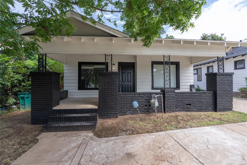 **Owner Financing Options Available** Discover the best of urban living in this charming bungalow, ideally located in central OKC, near the vibrant Midtown and downtown areas and only a few blocks away from OKC's Plaza District. With an oversized lot, this home provides a unique sense of space and privacy rarely found so close to the city's action. The fantastic curb appeal begins with a covered front porch, while inside, the living room showcases a beautifully painted original brick fireplace flanked by built-ins, and classic stained wood flooring that adds timeless character. The home features three bedrooms and a kitchen designed for both function and style, with painted cabinets, floor-to-ceiling storage, sleek granite countertops, and a subway tiled backsplash. The updated bathroom includes a large bathtub with a subway tiled shower surround, and the convenience of an interior laundry room is a great bonus. Outside, a small covered outbuilding offers additional storage, and the large yard is ready for your personal touch. Don't miss this opportunity to own a piece of classic OKC charm with an incredible location near all the city's best restaurants, shops, and entertainment.