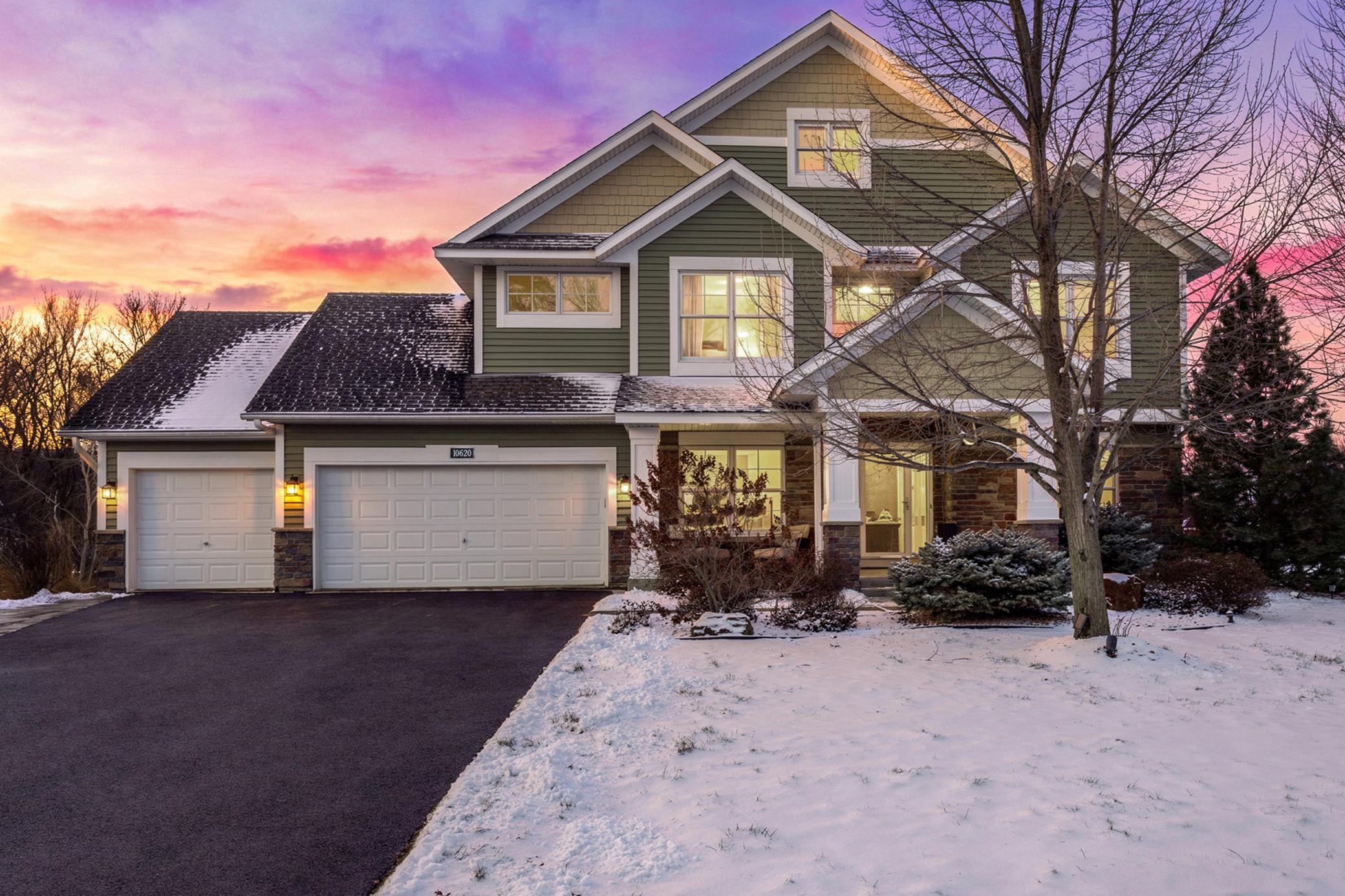 Nestled in the highly sought-after Lakeville School District, this stunning 4-bedroom, 4-bathroom home offers the perfect blend of space, style, and serenity. Positioned on a quiet corner lot at the end of a private cul-de-sac, the property is surrounded by mature trees and tranquil ponds, creating a peaceful setting while still being close to shopping, dining, and major roadways.Inside, soaring ceilings and an open layout set the tone for comfortable living and entertaining. The main level features a beautifully appointed kitchen with a center island, ample cabinetry, stainless steel appliances, and a convenient built-in desk, flowing seamlessly to casual and formal dining areas and a welcoming living room with a gas fireplace. An updated mudroom and a bright office add functionality to daily life.Upstairs, the primary suite is a serene retreat with vaulted ceilings, dual closets, and a private ensuite with a jetted tub, walk-in shower, and double vanity. Three additional bedrooms share a full bath and offer plush carpeting and generous closet space.The finished lower level expands living and entertaining options, featuring a family room with fireplace, wet bar, versatile den, bonus room, and additional bath. Outdoors, a spacious deck with gazebo, shed, basketball hoop, and a three-car garage complete this exceptional home. With extensive updates and meticulous landscaping, this property offers distinctive living spaces, abundant storage, and a tranquil, private setting.