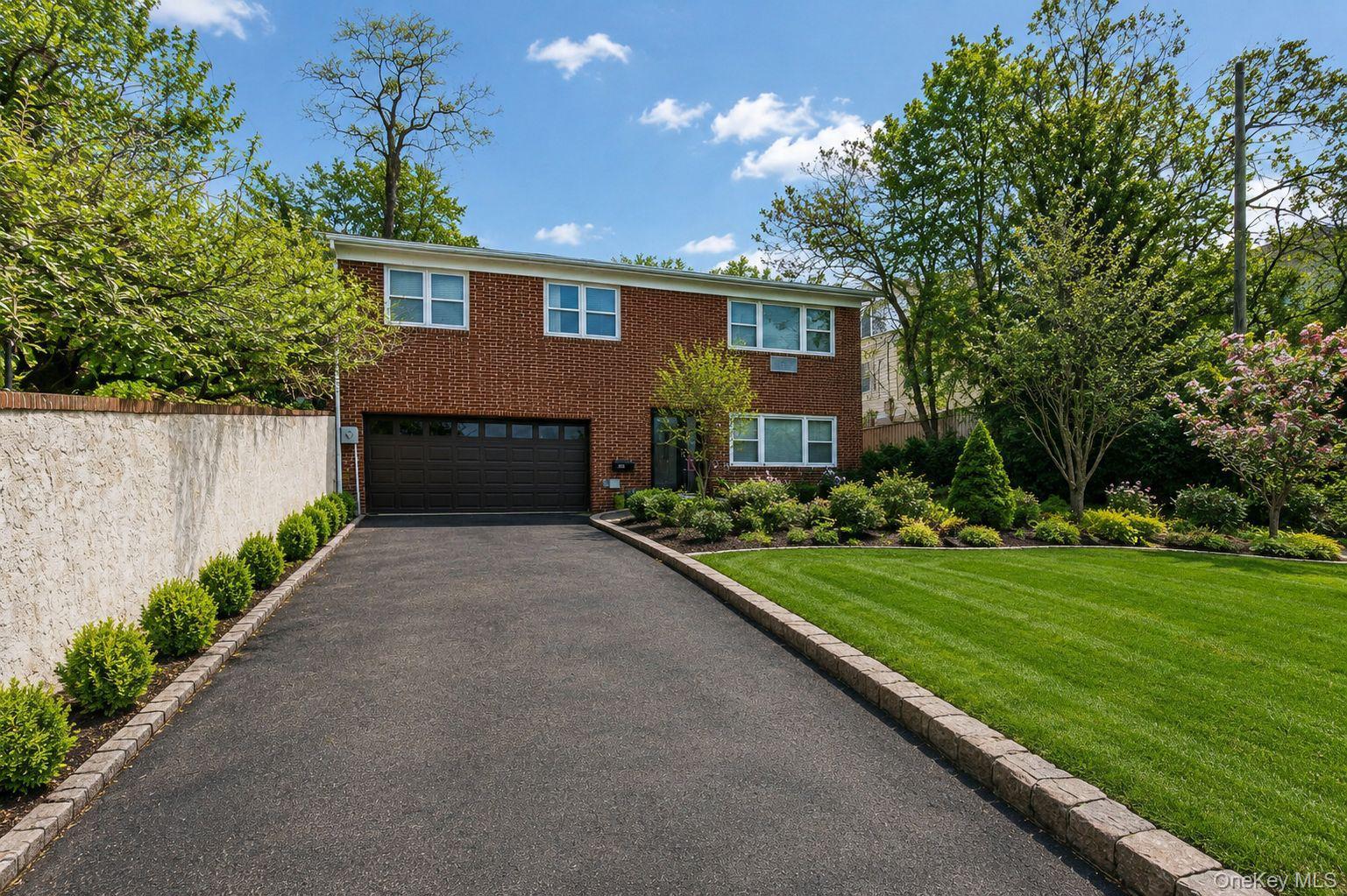 Exceptional Opportunity in Highly Desirable Northwest YonkersDiscover this exceptional single-family residence, perfectly situated in the highly sought-after Northwest Yonkers neighborhood. Combining timeless charm, generous living space, and exceptional functionality, this inviting home offers everything today's buyers are looking for.The home features,3 spacious bedrooms, 3 full bathrooms,  and a bright, sun-filled eat-in kitchen designed for both everyday living and entertaining. Rich hardwood floors throughout add warmth and character, while the thoughtfully designed layout provides comfort, versatility, and effortless flow.The finished walk-out lower level offers additional living space with excellent in-law or guest suite potential, making it ideal for extended family, overnight guests, a home office, or a recreation area.The classic brick exterior is complemented by an attached two-car garage and an oversized private driveway with parking for 4+ additional vehicles—a rare and highly desirable feature in the area.Step outside to a beautifully landscaped backyard and garden, creating the perfect setting for outdoor entertaining, family gatherings, gardening, or simply relaxing in your own private retreat.Ideally located near parks, shopping, dining, schools, public transportation, and major highways, this exceptional property offers the perfect blend of comfort, convenience, and accessibility.Whether you're searching for your forever home or a property with exceptional versatility and lasting value, this is an opportunity you won't want to miss.Please note: Select photographs have been virtually staged and/or digitally enhanced for illustrative purposes to showcase the property's potential. The furnishings depicted are virtual and are intended to help buyers visualize the possibilities while accurately representing the home's layout and features.
