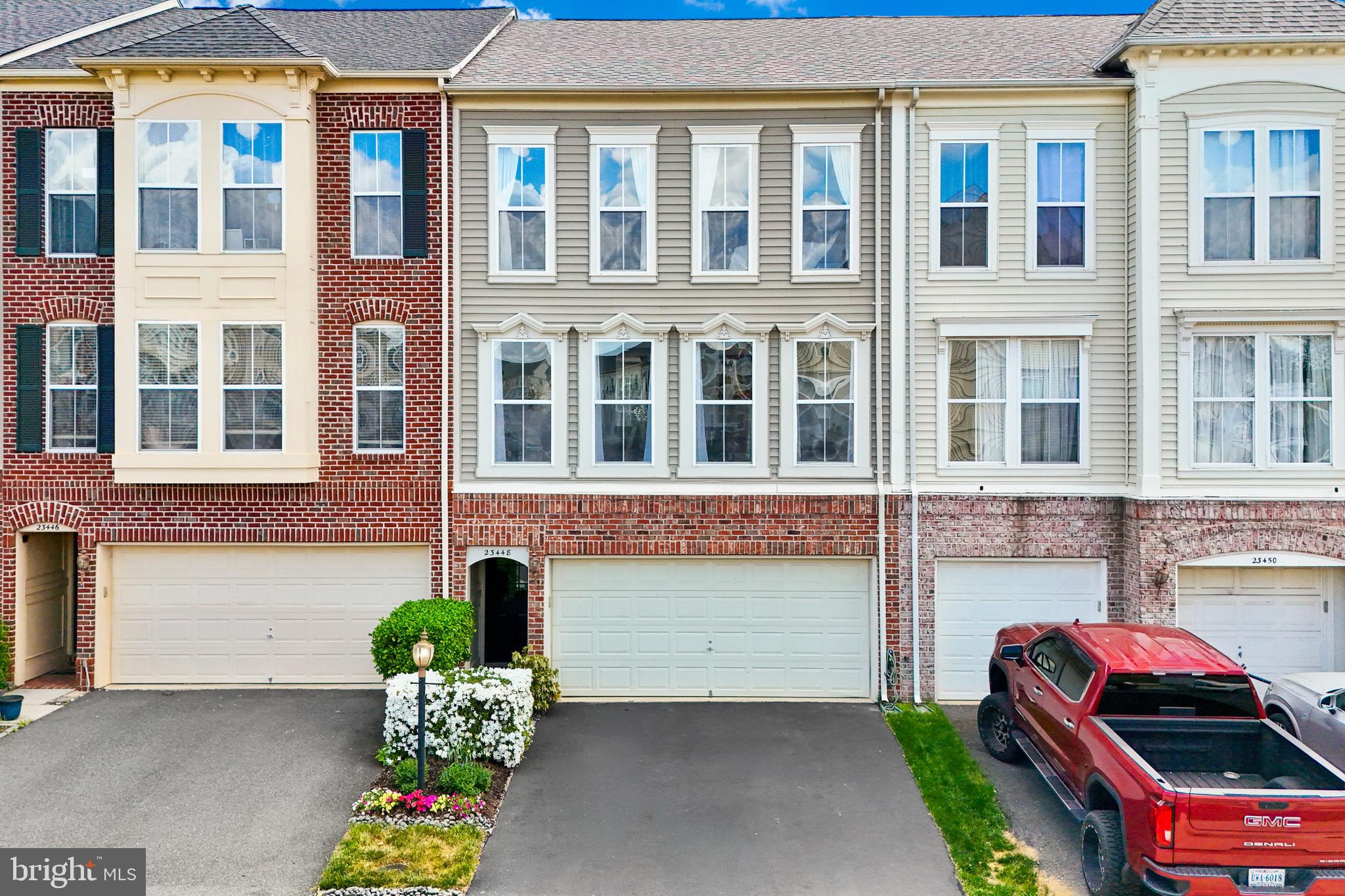 Welcome to this beautifully maintained home in the highly desirable Brambleton community! This 3-bedroom, 2 full bath, 2 half bath property offers the perfect blend of updates, functionality, and style.The thoughtfully designed floor plan offers comfortable and versatile living across all three levels. The lower level features a spacious recreation room and convenient half bath—ideal for a media space, home gym, or playroom. On the main level, enjoy a bright and open layout with a welcoming gerat room centered around a custom gas fireplace, a dining area perfect for entertaining, and an abundance of natural light throughout. Upstairs, the owner’s suite provides a relaxing retreat with two walk-in closets and a beautifully appointed en-suite bath. Two additional bedrooms and a full bath complete the upper level.The updated kitchen is a standout feature, complete with shaker-style cabinetry, granite countertops, subway tile backsplash, and stainless steel appliances—perfect for both everyday living and entertaining. Both full bathrooms have been tastefully updated with granite, ceramic tile floors and modern vanities. Hardwood floors on the stairs, main level, and in the owner’s suite add warmth and continuity, while updated plumbing fixtures and lighting throughout the home enhance its modern appeal. Major systems have been thoughtfully updated, including a new HVAC in 2025 and water heater in 2025, with a roof approximately 7–8 years old—providing peace of mind for years to come.Step outside to a fully fenced, landscaped backyard featuring a deck—ideal for relaxing or hosting gatherings. The garage is outfitted with high-end custom cabinetry, offering exceptional storage solutions.Impeccably maintained and move-in ready, this home combines quality upgrades with a prime location close to everything Brambleton has to offer.