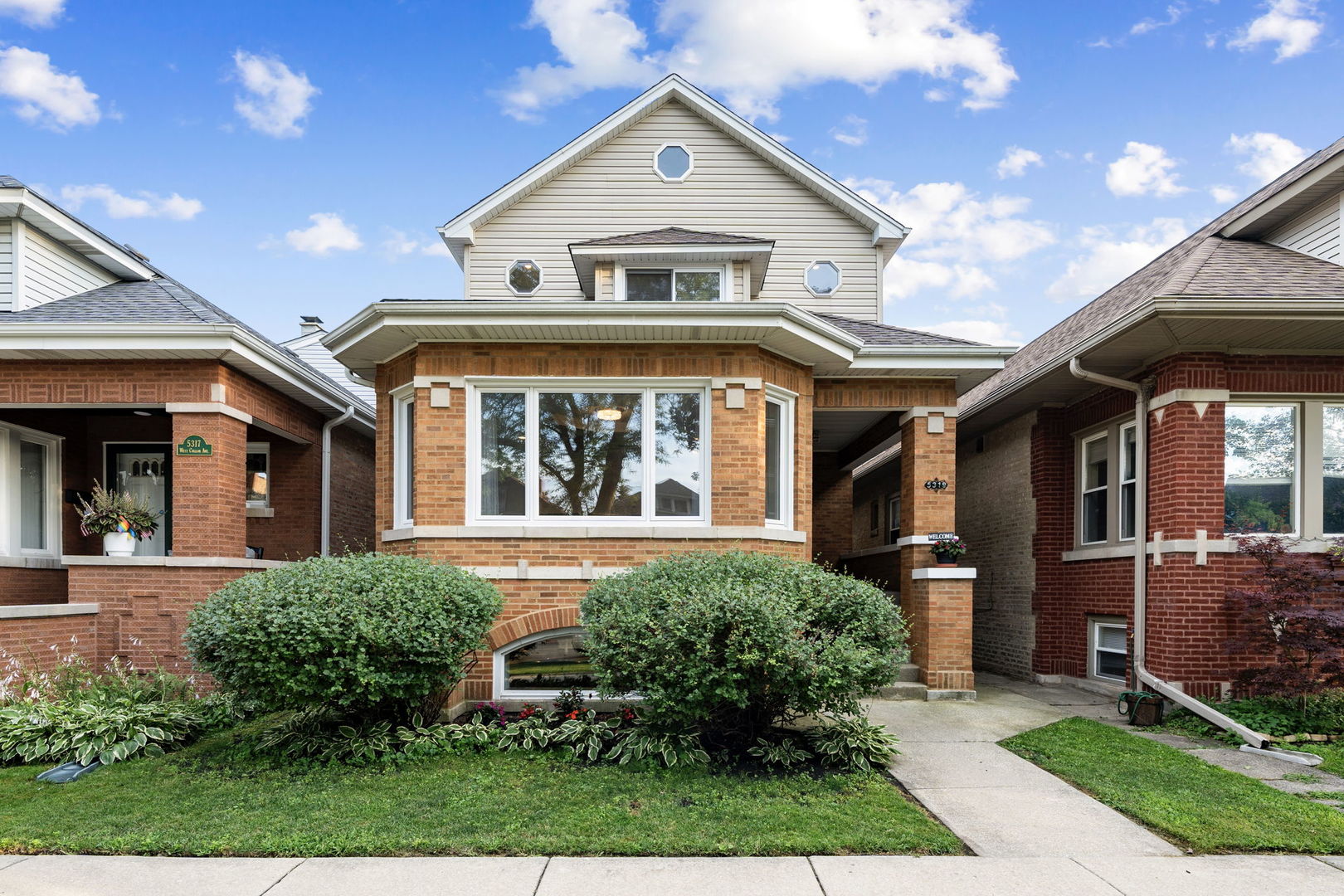 Classic Chicago Bungalow with Modern Space & Style in the Heart of Portage Park. Welcome to 5319 W Cullom, a stunning, expanded Chicago bungalow located in the vibrant and sought-after Portage Park neighborhood. With a full second-story addition, this spacious and meticulously maintained home offers the perfect blend of classic charm and modern living-ideal for buyers who love city life but crave more room to grow. Step inside to discover beautiful hardwood floors throughout, abundant natural light, and a thoughtfully designed layout, offering 4 bedrooms, 4 full baths, and generous living space across all three levels. The main floor includes a bright and airy living room, a separate formal dining room, and a sun-filled eat-in kitchen with a breakfast area and adjoining sunroom-perfect for morning coffee. The main level also features a full bath and bedroom, perfect for guests, an in-law setup, or a home office. Upstairs, the second-floor addition boasts 3 spacious bedrooms, 2 full baths, and a laundry area, including a luxurious primary suite with a walk-in closet and an elegant en suite bath featuring a soaking tub and separate shower. Skylights and thoughtful design create a bright and open feel throughout. The finished lower level is ideal for multigenerational living or long-term guests, offering a second full kitchen, 5th bedroom/workout room, full bath, walk-in closet, second laundry area, and private exterior access.  Outside, enjoy your own urban oasis-a beautifully landscaped yard with a sun deck, perfect for relaxing or entertaining. A 2.5-car garage adds ample parking and storage. This home offers excellent flood control and a 200-AMP service. With too many recent upgrades to list, this home truly shines. All the space you've been looking for-without sacrificing location. Just steps from Portage Park, popular coffee shops, local restaurants, farmers markets, and charming Chicago architecture, you'll love the walkability and community vibe. Convenient access to the expressway, Metra, and Jefferson Park transit hub makes commuting a breeze-whether you're headed downtown or to the suburbs. If you've outgrown your current space but aren't ready to leave city living behind, this is your opportunity to move into one of Chicago's most dynamic neighborhoods. Spacious, stylish, and move-in ready, this is the one you've been waiting for.