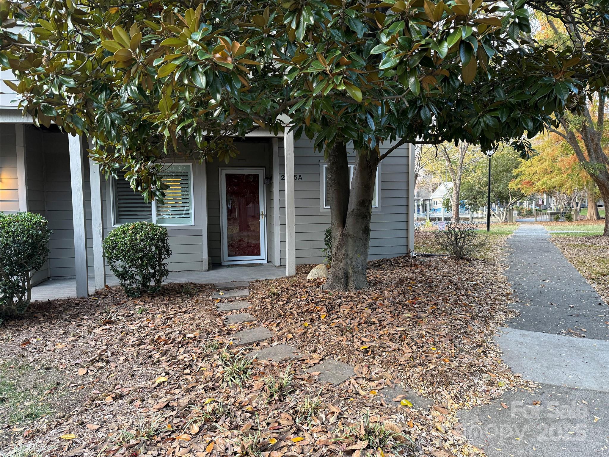 RARE opportunity for an end unit in the highly desired community of Creswick. Entering the condo, you will see the completely updated kitchen, beautiful cabinets, granite counters, smooth ceilings with can lights. Stainless appliances. Refrigerator to remain. The dining room, living room, kitchen offers an open concept. Crown moulding throughout and beautiful wood floors. Fireplace in living area is recessed into the wall. This is a feature for the end units. Current owner has never used the fireplace. 

Nice size primary with walk in closet. Incredible updated bathroom with plenty of storage. Walk/roll in oversized shower. Washer/dryer in bathroom to remain. The second bedroom is being used as an office and guest room.

Plantation shutters throughout, remote control blind in the living area. The windows in the dining area over look 3 of the ponds. The oversized sliding glass door overlooks the fourth pond with the water feature. The covered back porch has an incredible view of the pond with the water feature and is very soothing to listen to. 

Beautiful trees throughout the community with sidewalks to enjoy the outdoors. Walking distance to Quail Corners with all the shops, restaurants and Harris Teeter. The windows in the primary overlook the lake with the water feature and sliding glass door in the primary over looks all of the other ponds.

Community pool is nice, even better in this community, the resident's enjoy each other and spend time together. You can participate if you like and not if that is what you prefer.

Close to South Park and Pineville. 

Come and see if this could be "Your Happy Place" here in Creswick.