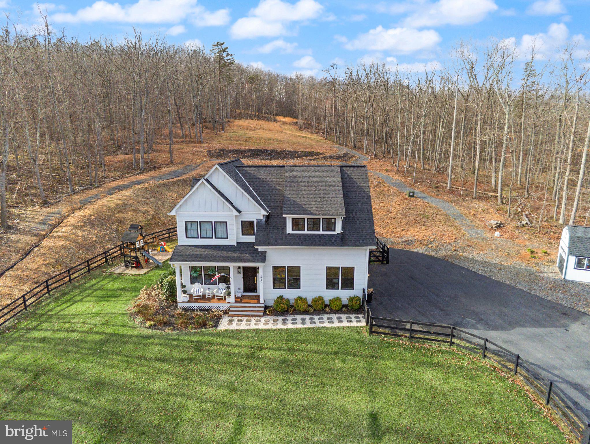 ***Back On the Market ***Welcome home, a place to relax, feel safe, belong!A private 10-acre Aldie estate thoughtfully curated and designed as a peaceful countryside retreat.Set across ten breathtaking acres with NO HOA, this extraordinary custom-built residence by MAC Builders offers the rare opportunity to experience refined estate living surrounded by nature. Mature trees, open skies, and sweeping views create an atmosphere of calm and privacy while the home reflects timeless craftsmanship and thoughtful design.Inside, a light-filled open floor plan unfolds with effortless elegance. The gourmet white kitchen, complemented by an expansive pantry and exceptional storage, flows seamlessly into the inviting family room anchored by a warm gas fireplace and the open dining area, creating a beautiful space for both everyday living and entertaining.A main-level bedroom with a full custom bath provides the perfect setting for guests, extended family, or multi-generational living. Just beyond the living spaces, a covered porch invites you to slow down and enjoy quiet mornings, peaceful evenings, and uninterrupted views of the surrounding countryside.Upstairs, the home offers four spacious bedrooms and three and a half baths, including a stunning primary suite designed as a private retreat. Wake to serene views and step directly onto your private upper-level deck overlooking the property. The spa-inspired primary bath features dual vanities, a freestanding soaking tub, a beautifully designed custom shower, and an impressive wrap-around walk-in closet. An upper-level laundry room adds everyday convenience.The walk-up lower level expands the home’s lifestyle offerings with a large recreation area, custom bar, an additional bedroom, and a full bath, along with a custom-built playroom designed to inspire fun for all ages.Outside, the property continues to impress with a fully fenced front yard, two-car garage, and a custom-built shed that can serve as a secondary garage, workshop, or additional storage space. The outdoor playset conveys with the home, adding another wonderful feature to the expansive outdoor setting.Served by private well and septic, this remarkable property offers the rare combination of acreage, privacy, and modern luxury while remaining just minutes from Aldie, shopping, dining, commuter routes, and the best of Loudoun County living—and just 10 minutes from Middleburg, offering convenient access to its charming shops, restaurants, and historic small-town atmosphere.A truly special Northern Virginia countryside estate where every sunrise feels peaceful, every gathering feels special, and every day feels like coming home.