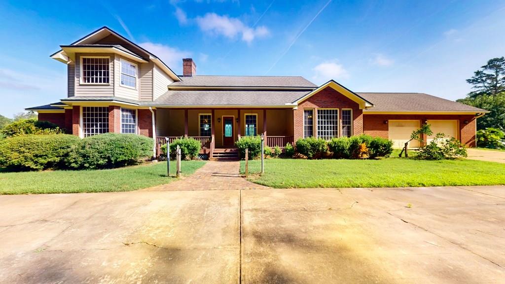 This truly unique property offers over 4,000 square feet of stunning craftsmanship, featuring rich wood interiors throughout the floors, walls, and ceilings. The warm, rustic charm is perfectly complemented by a beautiful fireplace, creating a cozy yet elegant atmosphere. With 4 spacious bedrooms and 5.5 baths, this home is thoughtfully designed for both comfort and privacy. Two upstairs bedrooms include full en-suite baths, while two of the bedrooms feature private sitting areas overlooking a peaceful pond—ideal for quiet mornings or evening relaxation. An additional outbuilding expands the possibilities, offering a separate living area, kitchen space, workshop, and generous storage—perfect for guest accommodations, a studio, or hobby space. Set beside the historic Beetlejuice Plantation, this property is not only rare but unforgettable. A true gem with endless potential!