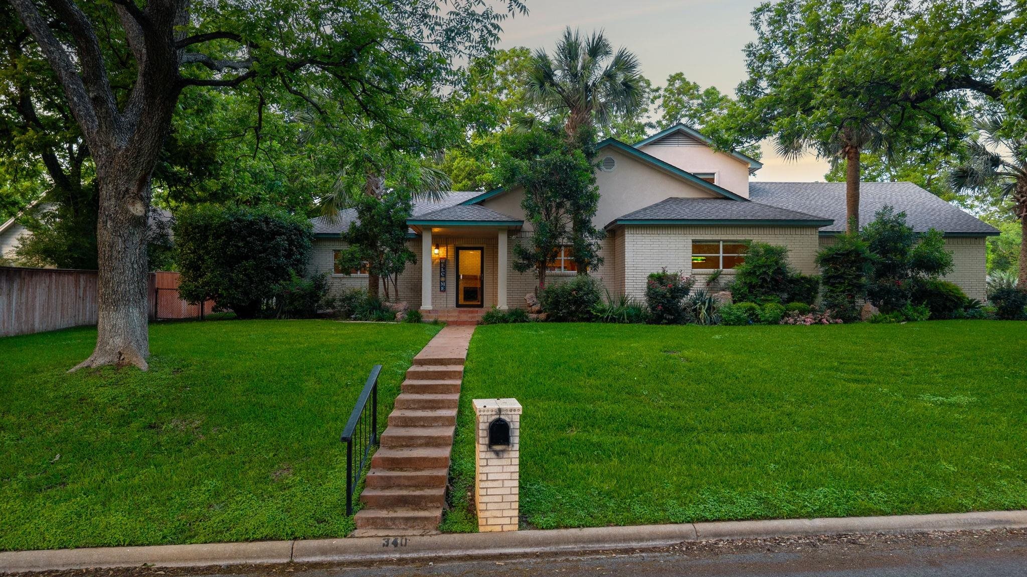 Welcome to 340 Columbine in Meadowlakes, a 24/7 guard-gated golf course community in Marble Falls, Texas offering access to Lake Marble Falls, pickleball courts, and an active lifestyle, with a planned clubhouse expansion adding even more appeal.  This thoughtfully designed home is ideal for multi-generational living, featuring two primary suites on the main level, each with spacious en-suite bathrooms and walk-in closets, perfect for extended family, guests, or flexible living arrangements.  The home offers a large kitchen with center island, abundant cabinetry, and extensive storage, opening to the main living areas for easy entertaining. A formal dining room provides dedicated space for gatherings, while the game room with pool table (conveys) adds a fun bonus.  Upstairs includes two additional bedrooms connected by a Jack-and-Jill bathroom, creating a functional and private layout.  Additional highlights include an immaculate 2-car attached garage plus a golf cart garage, ideal for enjoying Meadowlakes amenities and golf course living.  The beautifully landscaped yard on a corner lot enhances the home’s curb appeal and outdoor enjoyment.  Enjoy the security, convenience, and lifestyle of Meadowlakes, just minutes from shopping, dining, and Lake Marble Falls recreation.