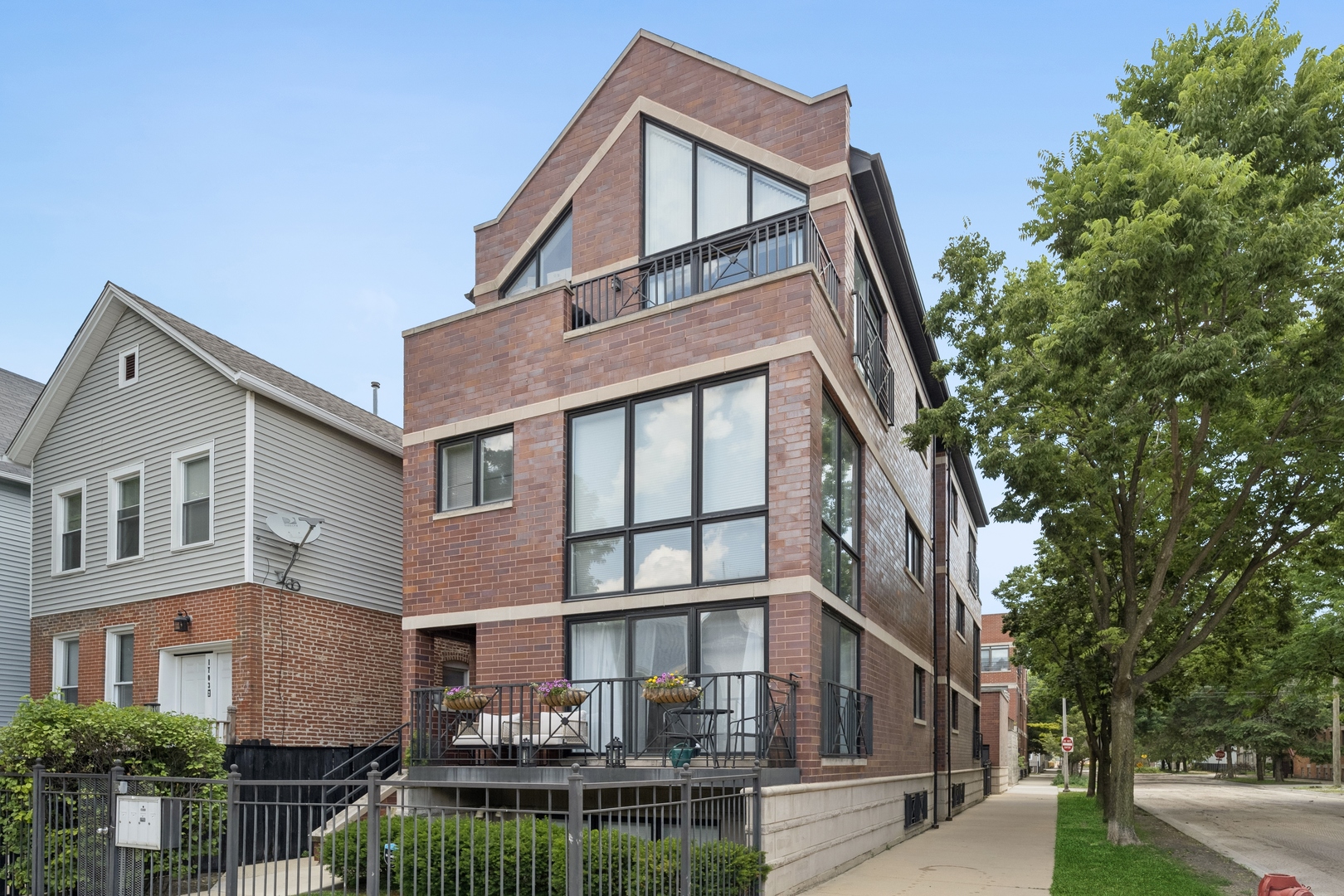 Sunny corner lot triplex in West Bucktown with huge garage roof deck!  Tons of natural light!  3 bedroom 2.5 bath with sunny office den/nook space.  Private rear entrance with yard.  Shared rooftop deck and private deck off of the living area.  Hardwood floors, gas fireplace, stainless steel appliances, large pantry, and plenty of storage space.  Nice organized closet space.  Large primary bathroom with separate jacuzzi tub and steam shower.  Garage parking spot with room for more storage.  Great location near all the shops/bars/restaurants that Bucktown/Logan Square/Wicker Park offer.  Steps to the 606 Trail!!  Close to the Western Blue line.  Great views from the unit.  Shows very well!
