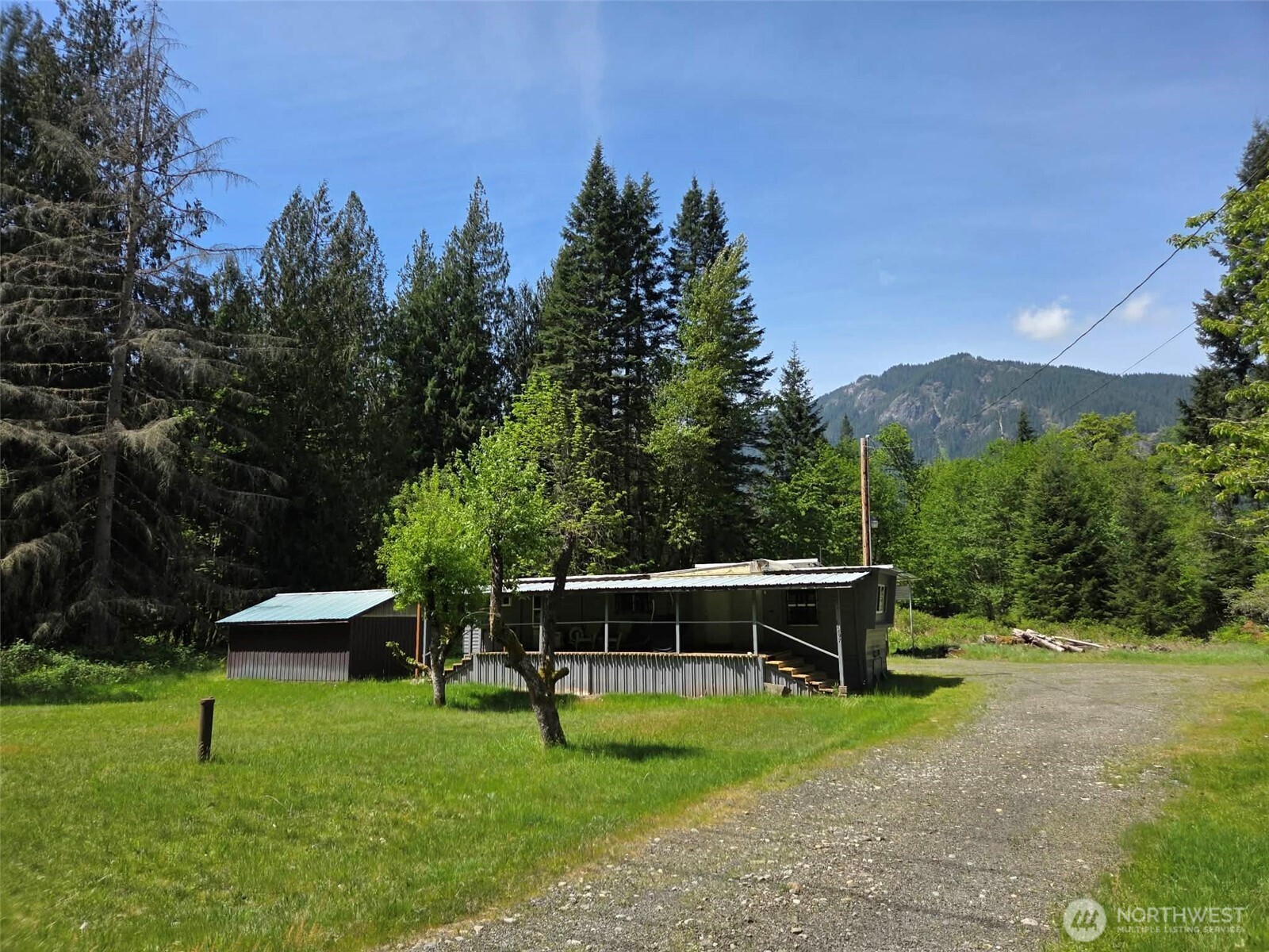 More than a cabin, this is your own private mountain recreation property. Offered together are an updated, fully furnished cabin on 1.08± acres PLUS a separate 5± acre wooded parcel, creating over 6 acres of opportunity just minutes from Randle, Packwood, White Pass Ski Area, Mount Rainier National Park, Mount St. Helens, and thousands of acres of Gifford Pinchot National Forest. Whether you’re looking for a weekend escape, hunting camp, vacation rental, or future homesite, this property offers flexibility that’s hard to find. The cabin is move-in ready with an updated kitchen, comfortable living area, 2 bedrooms, full bath, laundry, and furnishings included. Outside you’ll find a spacious shop, storage shed, large RV carport with hookups, and room for trailers, toys, and equipment. The separate wooded parcel provides privacy, recreational space, and potential for future development (buyer to verify). Ride, hike, hunt, fish, ski, or simply relax around the fire after a day exploring the mountains. Recent septic servicing and manufactured home title elimination add value and peace of mind. Seller prefers to sell both parcels together and is offering owner financing with flexible terms, making this a rare opportunity to own a mountain retreat without relying on traditional bank financing. Properties offering this combination of land, improvements, recreation, and flexible financing are rarely available.