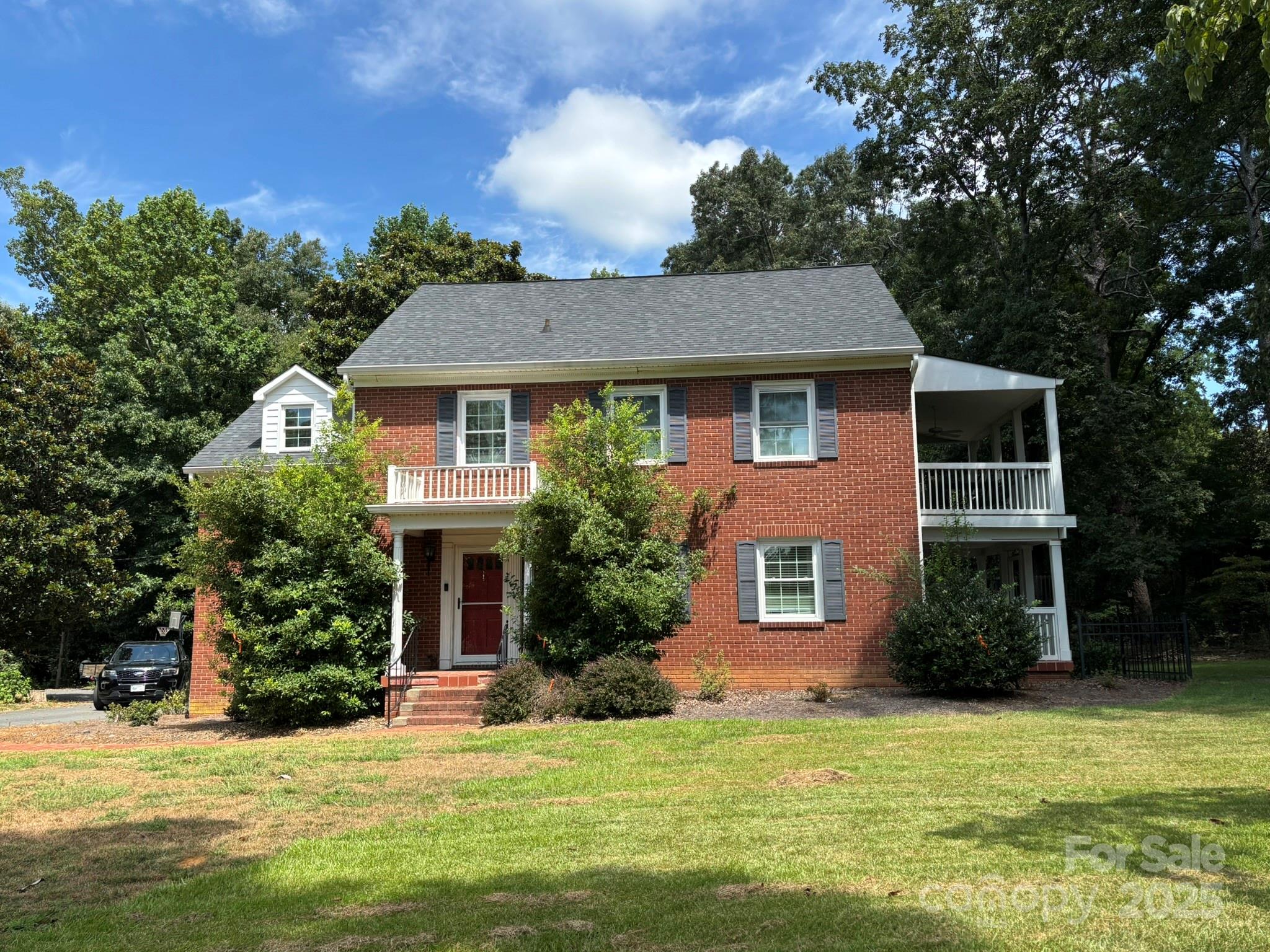 TROY - Stately, custom 4-bedroom, 2.5 bath brick 2-story home. One of the secondary bedrooms currently has washer/dryer connected (washer/dryer can be moved back to original laundry area in basement which is plumbed and wired accordingly).  Features beautiful hardwood floors, large eat-in kitchen, dining room, laundry room, office.  Enjoy quiet mornings and relaxing afternoons from the screened porch.  The home sits on a lovely landscaped 2-acre tract.  Ideally located near shopping, schools, medical facilities.  This property is just a short drive to lake Tillery, the Uwaharrie Mountains and near many golf courses.
