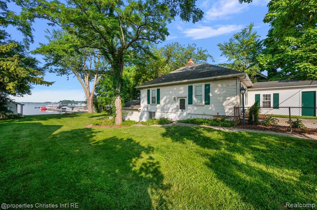 Incredible opportunity to own the perfect lakefront property with approximately 60ft of pristine frontage and picturesque views year-round on the north side of highly sought-after, all-sports Whitmore Lake! *Immediate occupancy with more than half of the summer season still ahead!* Offered at a phenomenal value with crystal-clear Pure Michigan lake frontage floating across a clean sandy bottom with minimal maintenance and an extended private dock, this property features a conventionally-shaped 135ft deep parcel with a well-kept dwelling that was fully gutted and remodeled in 2010 - versatile and suitable for those looking to live on the lake, own a second home/lake-house at an extremely affordable price, or build custom with a massive building-envelope and endless possibilities! Embrace coziness and tranquility with a beautiful, open dwelling with vaulted great room ceilings, updated kitchen with granite counters and stainless steel appliances, two full updated bathrooms, two fireplaces, three spacious bedrooms and an attached garage - sprawling fenced yard perfect for dogs, children, parking, entertaining, outdoor activities and summer fun! Embrace the "Up North" lifestyle while still being conveniently close to everyday amenities and only minutes from Downtown Ann Arbor! A rare find in today's market that will not last!