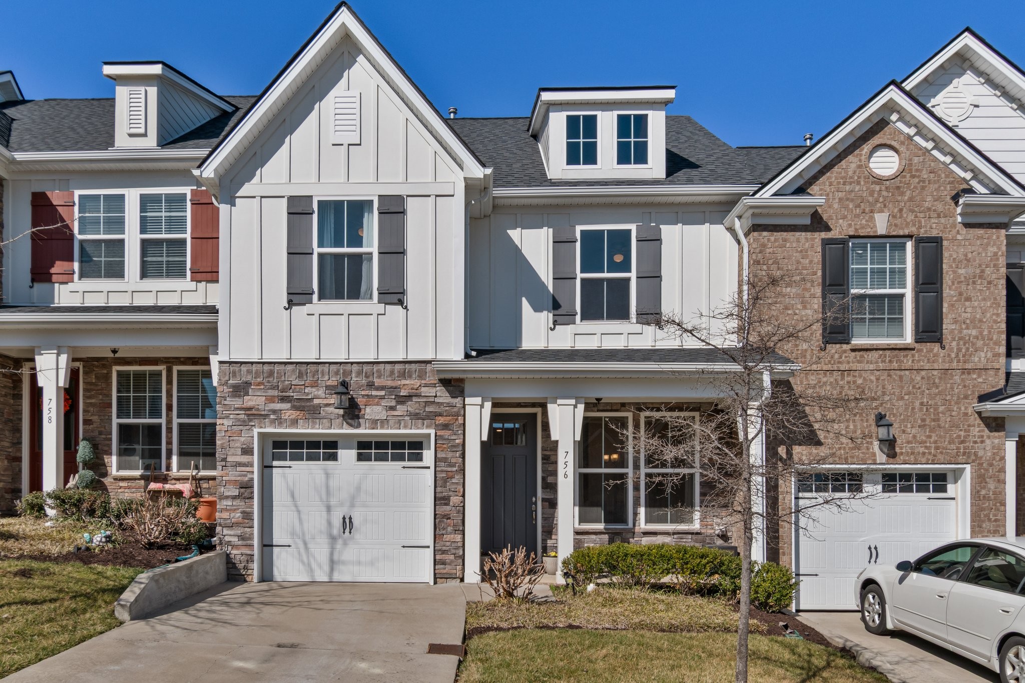 Welcome to 756 Tennypark Ln, a stunning property nestled in the heart of Mount Juliet, Tennessee. This charming home is located in the desirable Nichols Vale community. As you step inside, you'll be greeted by an open concept living space that seamlessly blends modern design with cozy comfort. The spacious living room features large windows that flood the area with natural light, creating a warm and inviting ambiance. The upgraded gourmet kitchen is a chef's dream featuring 5 burner gas range and dual ovens, equipped with stainless steel appliances, granite countertops, ample cabinet space, and a walk-in pantry. It's perfect for hosting dinner parties or enjoying a quiet meal with family. The master suite is a true retreat, offering a luxurious en-suite bathroom with a tiled shower and large walk-in closet. Additional bedrooms are generously sized, providing plenty of space for family or guests. The community offers a range of amenities, including walking trails, a clubhouse, a pool, and a playground ensuring there's always something to do.