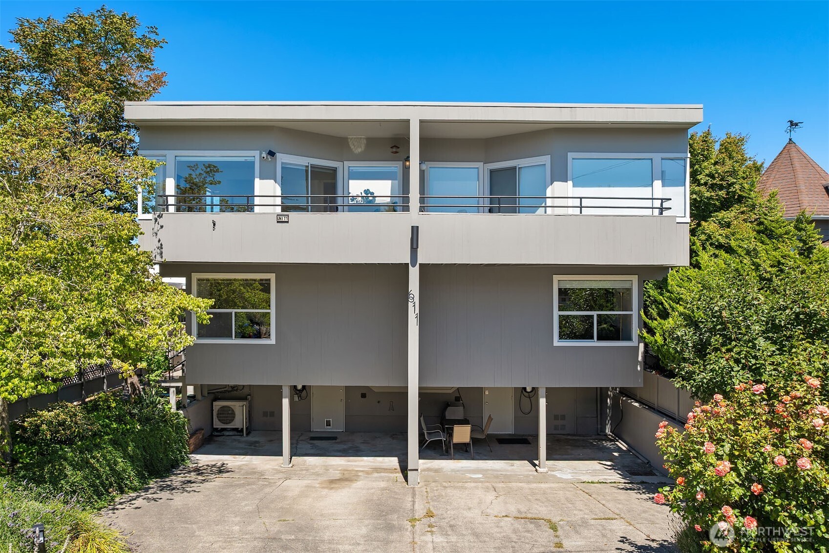 Edmonds Bowl! Live in the heart of downtown Edmonds, just one block from Main Street and moments from restaurants, shops, cafés, Civic Park, the waterfront, beaches and the Edmonds-Kingston ferry. One of only four homes in the complex, this light-filled, move-in-ready townhome-style condo offers two bedrooms, each with its own bath, plus a generous den/family room ideal for a home office, media room or guest space. The upper-level primary suite features a large walk-in closet and views of Puget Sound and the Olympic Mountains. Updates include the kitchen and baths, flooring, paint and fixtures. High ceilings, skylights and large windows bring in abundant natural light, while mini-split heating and air conditioning provide year-round comfort. Ziply internet is available. Enjoy a private patio, upper deck and individual gardening space. Two parking spaces include one covered carport space and one tandem space directly behind it, plus substantial storage. A rare combination of space, privacy, views and exceptional walkability in one of Edmonds’ most sought-after neighborhoods.