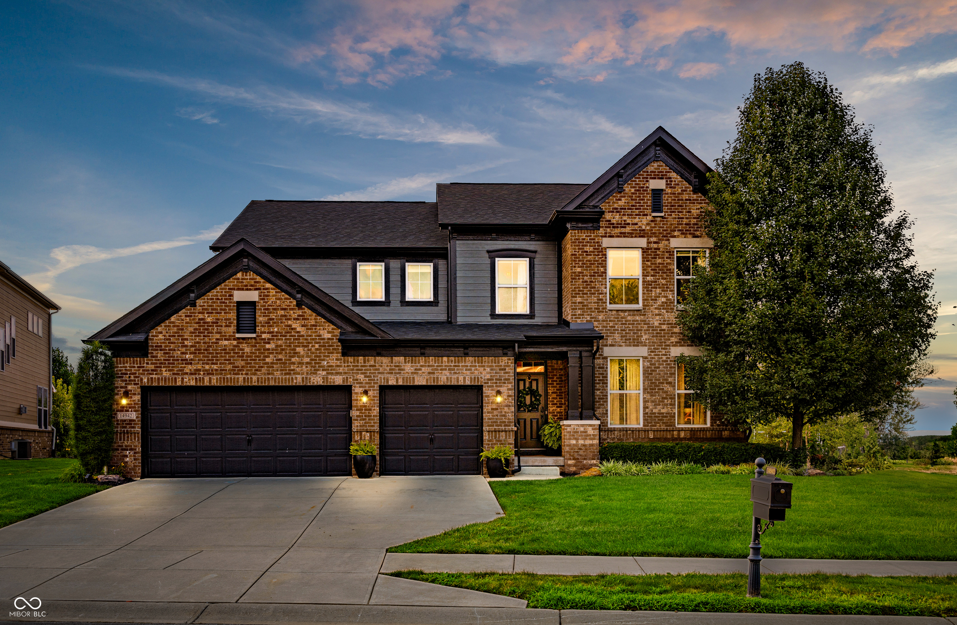 Thoughtfully styled with smart space in all the right places, this 4 bedroom, 3.5 bath home in The Village at Bridgewater offers over 4,000 square feet of finished living. The exterior features clean contrast - warm brick meets matte black siding with a wide 3 car garage up front. Inside, the layout flows. Custom built ins ground the main living space, while the kitchen centers everything with a massive island, casual dining space, and direct access to a shaded porch and fully invisibly fenced backyard with fire pit. A barn doored office and tucked away work nook add function without stealing space. Upstairs, the primary suite makes a statement - double door entry, tray ceiling, sleek fireplace, remodeled bath, and laundry access right off the walk in closet. Three more bedrooms and a loft live separately, just enough distance without disconnecting. Downstairs is fully finished with a full bath, wet bar, ample storage, and space to stretch out or disappear for a bit; perfect for game or movie night. Just outside your door, the Bridgewater Club offers more than amenities - it's a lifestyle where golf, fitness, pool, and dining come together to make every day feel a little more elevated.