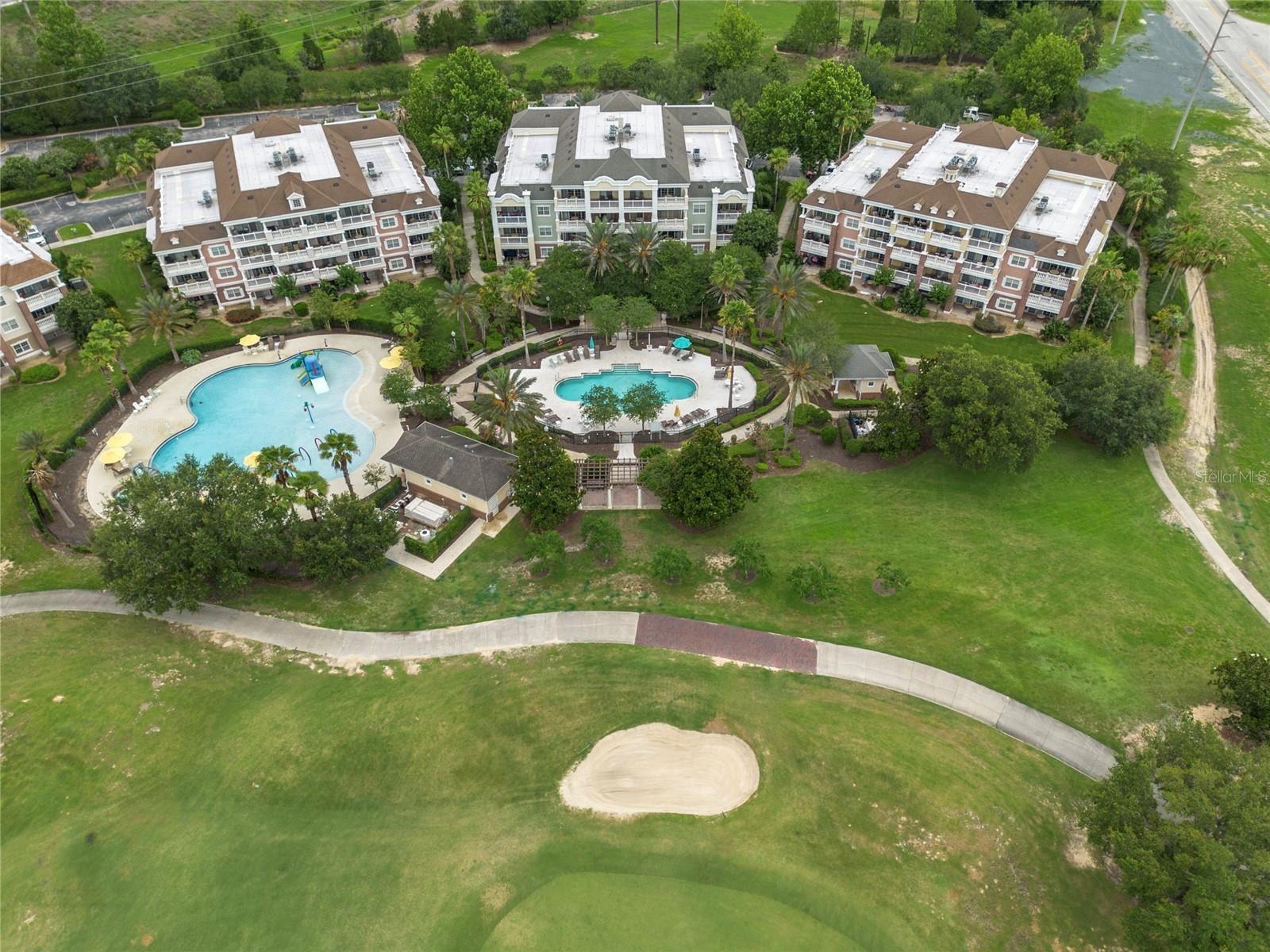 REUNION MEMBERSHIP PROPERTY AND EASY TO SHOW- Luxury, Lifestyle and Legacy!  Let’s not forget Location! There are only a few Villas in Reunion that will provide you exclusive golf course views and be within steps of the 2 dedicated Villa Pools and water features.   This is your second-floor updated villa property that you have waited for, and it won’t last long.  Welcome to 7600 Sandy Ridge Drive Unit 204.  The property will have an ACTIVE REUNION MEMBERSHIP that can be transferred to the new owner.  The unit is NOT in a rental program and is in impeccable condition.  A bright and breezy feel inside with tons of natural light that flows in from the multiple windows.  The property is an end unit that also includes it's own PRIVATE storage closet.  Once inside you will notice the multiple upgrades that include the new flooring, lighting, furniture and a re-imagined master bath and shower.   This highly desirable open-air floor plan is perfect for those wanting the best of what Florida Villas inside Reunion showcase.  With two private guest rooms and accompanying baths, the master is positioned away from guests’ rooms and has dual closets and also a double vanity.  At 1755 square feet this unit has all the space you need to just relax and enjoy.  An added feature is that this unit will come fully furnished.  LOCATION might just be the reason you buy this one.  You get both Golf Course Views and are literally footsteps to two resort exclusive pools and water features.  This is THE ONLY LOCATION in Reunion that will give you that.  Pay special attention to the photos and you will see why.   Live, Vacation, and Invest in REUNION!  A Gated Community, Reunion is home to 3 Signature Golf Courses, the Nicklaus, the Palmer and The Watson. It is A Golf Cart Friendly community that is filled with activities for all, including Tennis, Putt-Putt, A Golf Simulator, Pickle Ball, Member Events, Parties and a world class Waterpark that has something for all ages including its own lazy river!  Reunion is super close to theme-parks, shopping, and beaches and is minutes to Disney.  Don't let this one get away- Call and schedule your private showing today!