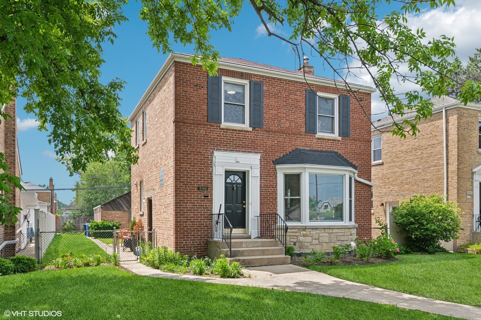 This is not your average Georgian. Completely reimagined in a full gut renovation just three years ago, 5146 N. Mobile blends classic architecture with contemporary sophistication in one of Jefferson Park's most desirable pockets.  From the moment you enter, the refined details will impress-starting with the stunning coffered ceiling in the sun-drenched living room. Thoughtful upgrades and designer finishes are showcased throughout, including crown molding, custom blinds, dimmer-controlled lighting, and wide-plank hardwood floors.  The smart layout features three bedrooms on the upper level and a rare main-level primary bedroom-ideal for convenience and privacy. The fully renovated kitchen is a true showstopper, appointed with gleaming quartz countertops, high-end stainless steel appliances, stylish backsplash, and ample custom cabinetry.  Enjoy beautifully remodeled baths (1.1), complete with sleek fixtures and timeless tilework. The finished lower level offers exceptional flexibility, with a sprawling family room, built-in TV and cable hookups, and a bonus room-perfect for a playroom, guest suite, or home office. Additional comforts include auto-lighting closets, a new sump pump with flood-proof drain, and new garage door opener.  Major mechanicals have all been updated: New furnace (2022) New AC (2021) Double-pane windows throughout  Set on a tree-lined street just minutes from Ridgemoor Country Club, Dunham Park, top-rated schools, and the shopping/dining of Harlem & Foster, this move-in-ready residence is also perfectly situated for commuters-just a short walk to the UP-NW Metra at Gladstone Park and nearby CTA transit.  This home is the perfect blend of form, function, and style-designed to impress and built to last.