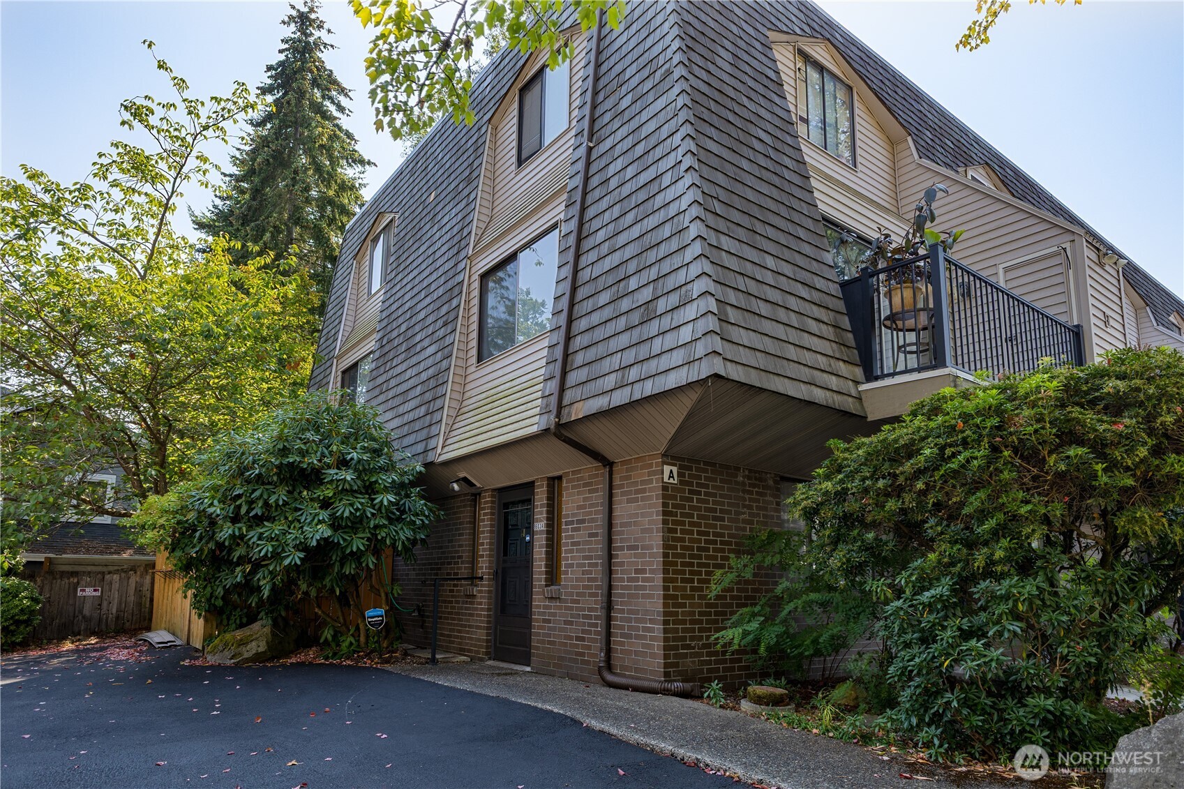Discover easy Edmonds living in this inviting ground-floor condo at Les Chateaux! Offering a spacious, functional layout and an unbeatable location, this home puts shopping, dining, everyday conveniences, and the charm of the Edmonds waterfront just minutes from your door.  Inside, a welcoming tiled entry leads into a comfortable living space highlighted by a freestanding wood-burning fireplace—perfect for cozy evenings at home. The separate dining area opens directly to a sunny patio and fully fenced side yard, creating a versatile outdoor retreat with room for a BBQ, gardening, pets, or play. The thoughtfully designed floor plan features two bedrooms and 1.75 baths, along with a newly renovated kitchen, recently updated electrical, and an updated ADU shower. Enjoy the convenience of an in-unit washer/dryer, dedicated storage, a covered carport, plus an additional uncovered parking space for a second vehicle. With a low HOA and a location that makes it easy to enjoy all that Edmonds has to offer, this is a wonderful opportunity to make homeownership simple, comfortable, and convenient!