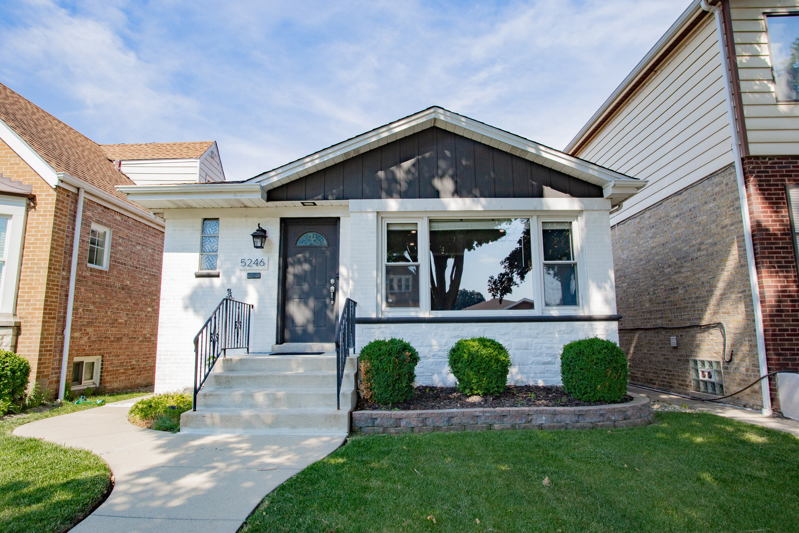 Welcome home to this stunning renovated ranch in the heart of Jefferson Park! Thoughtfully updated in 2022, this home offers the perfect blend of style and functionality. The spacious living room, highlighted by a custom accent wall, is ideal for both relaxing and entertaining. The modern kitchen features sleek, dual-toned cabinetry, quartz countertops, stainless steel appliances, and a breakfast bar that opens to the dining area. Three generously sized bedrooms, a gorgeous full bathroom, and an enclosed porch - perfect for a mudroom,  home office or playroom - complete the main level. The porch opens to a large, beautifully maintained backyard and a 2-car garage. The walk-out basement offers even more living space with a large family room, wet bar, office, second full bathroom, plus a spacious storage/utility room and laundry area. Fantastic location near parks, schools, shopping, restaurants, Metra, CTA trains, I-90, and more!
