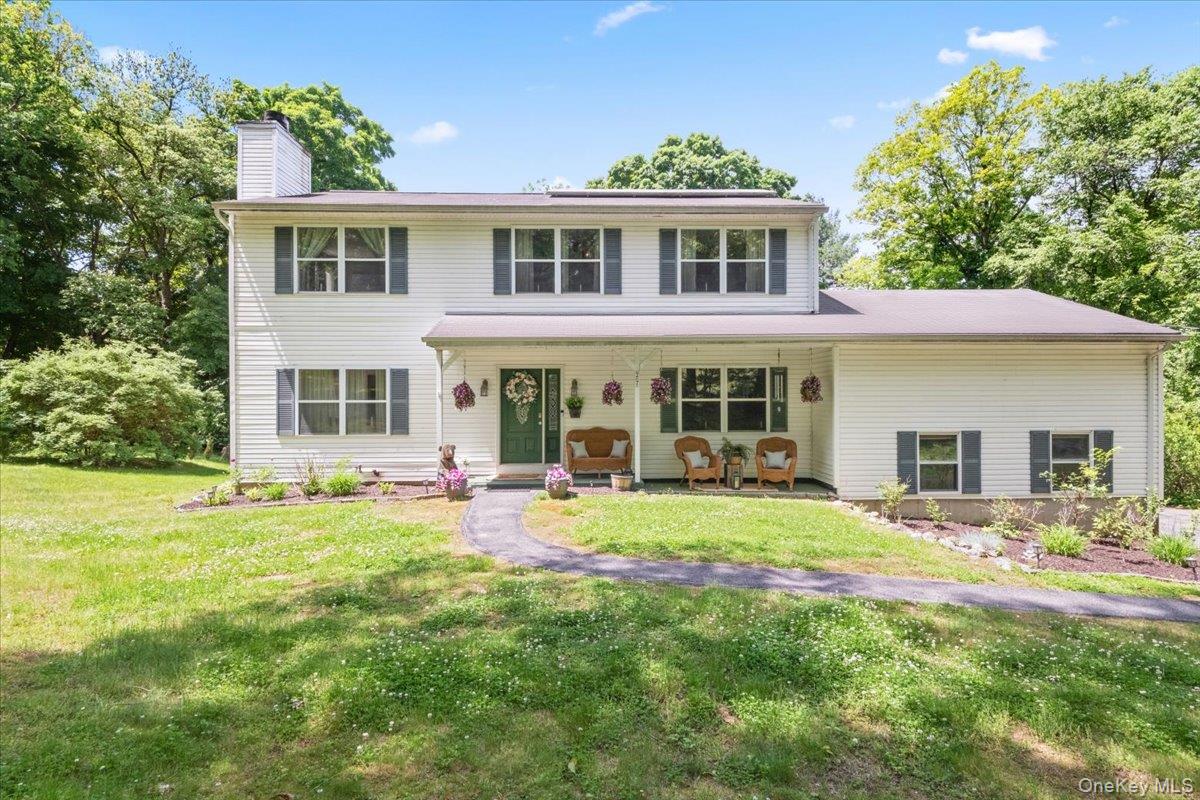 A home that truly checks every box has officially arrived in one of Cortlandt Manor’s most desirable locations, perfectly paired with sought-after Putnam Valley Schools. Here, you get the best of both worlds — all the conveniences and amenities Cortlandt is loved for, including the incredible town pool, while still enjoying the peaceful beauty, privacy, and country charm that make the Valley so special. From the moment you arrive, this home simply feels welcoming. Deceptively spacious and beautifully laid out, this impressive home offers a whopping 3,483 square feet including the finished bonus room and expansive walk-out basement. While officially a 3-bedroom home, it lives effortlessly like a true 4-bedroom thanks to the enormous bonus room above the garage that serves perfectly as a private primary suite retreat complete with soaring ceilings, a walk-in closet, and a full bath with double vanity. Inside, warmth and comfort fill every space. The charming living room with a wood-burning fireplace flows seamlessly into a soothing family room, creating the perfect setting for everyday living and entertaining alike. The updated kitchen is absolutely gorgeous with crisp white cabinetry, granite countertops, stainless steel appliances, and sliders leading out to a scenic deck that feels like your own private escape. Just off the kitchen are a convenient laundry room and powder room, while a graceful opening carries the flow right into the formal dining room. The upper levels continue to impress. In addition to the bonus suite, the second floor features three spacious and sun-filled bedrooms, including another bedroom suite with its own private bath, soaking jet tub, and two closets. Two additional bright bedrooms and a beautifully maintained hall bath complete the level. And just when you think the home couldn’t offer more, the incredible walk-out basement opens up endless possibilities. With approximately 750 additional square feet and another full bath, the space lives beautifully as an in-law setup and offers tremendous flexibility for extended family, guest quarters, recreation space, home offices, a gym, or whatever your lifestyle needs may be. The efficiency here is simply remarkable. Thanks to the solar panel system, electric bills average around just $25 per month, with even the highest bills staying around $100 monthly for a family of six. In today’s world, that kind of efficiency is almost unheard of. The solar lease is only $136.91 per month, making this an incredibly smart and cost-effective home to own. Outside, the property is just as appealing with a two-car garage, the beautiful oversized deck, and the perfect amount of yard space to relax, entertain, and play without overwhelming maintenance. Located just minutes to the Taconic, train stations, schools, shopping, restaurants, and all the conveniences along Route 6, this location makes everyday living effortless while still feeling tucked away from it all. This is the kind of home buyers wait for — spacious, versatile, efficient, and filled with warmth at every turn.