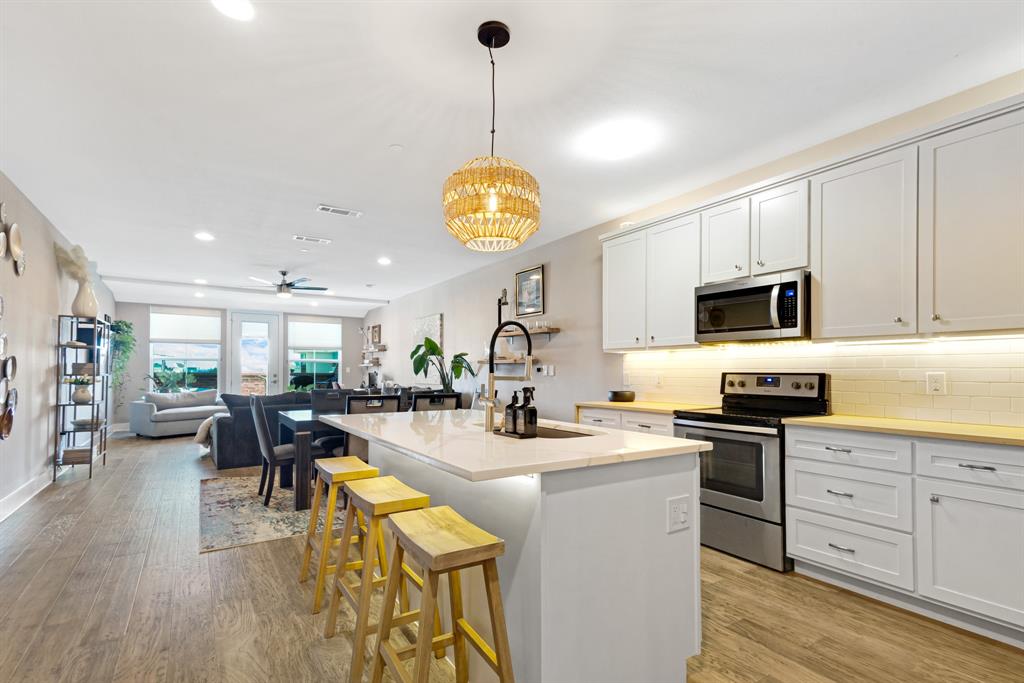 Discover the charm of Old Town Lewisville in this inviting second floor, single story condo. Featuring 2 bedrooms and 2 full baths, this home blends comfort and convenience in a prime location. The open-concept living and kitchen area creates a spacious, welcoming atmosphere perfect for everyday living or entertaining. Step outside onto your private balcony, ideal for enjoying morning coffee or relaxing in the evenings. Both bedrooms are generously sized, offering flexibility for a guest room, office, or personal retreat. The oversized tandem two car garage provides ample parking and storage, a unique advantage in this area. Located in the heart of Old Town, you’ll be just steps away from shopping, dining, entertainment, and community events while still enjoying the comfort of a quiet residential setting. Whether you’re a first-time buyer, downsizing, or seeking an investment, this condo delivers a perfect blend of lifestyle and value in a vibrant, historic neighborhood