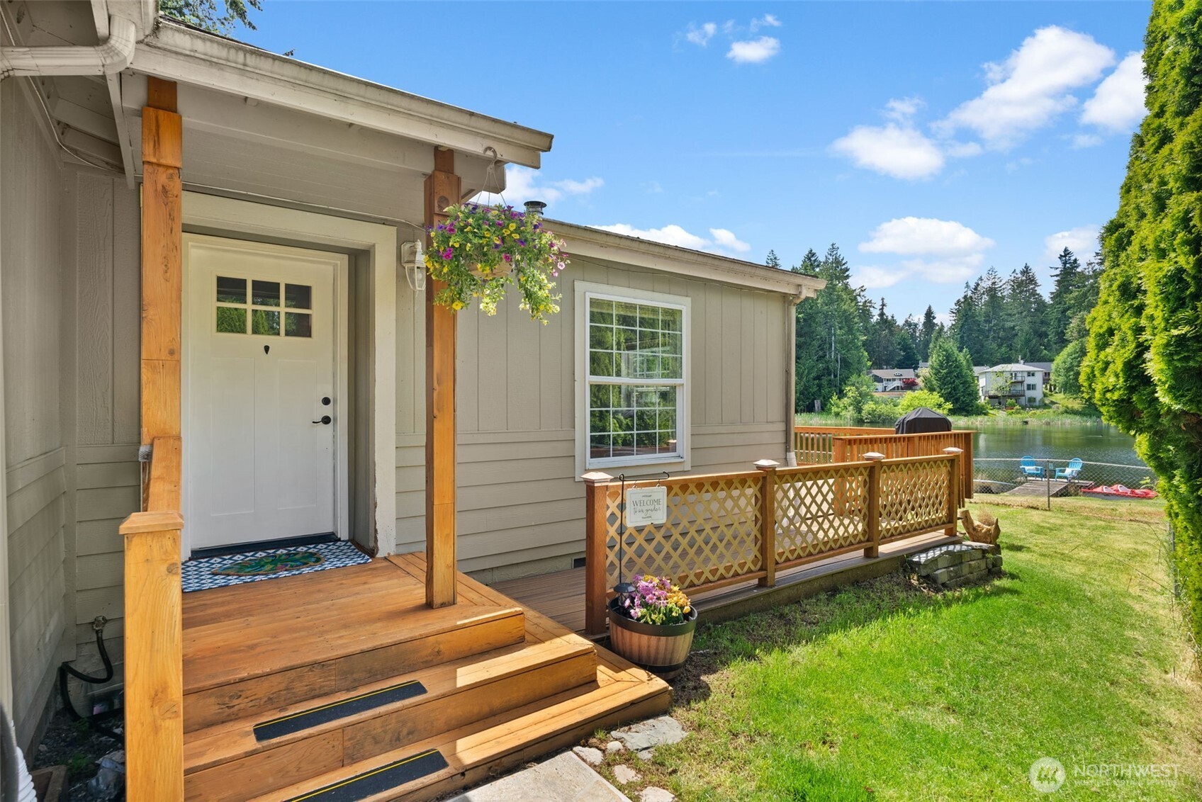 Welcome to your peaceful, single-level lakefront retreat featuring 54 feet of pristine, no-bank lake frontage and a private dock-perfect for kayaking, fishing, or unwinding by the water. Tucked at the end of a quiet cul-de-sac, this fully fenced property offers gated entry and exceptional privacy.Inside, skylights flood the home with natural light, highlighting fresh interior paint, updated kitchen cabinets and hardware, a versatile mudroom, a spacious den, and three inviting bedrooms designed for comfortable, easy living. A heat pump provides efficient heating and cooling. Step outside to a beautifully landscaped yard with a garden shed and expansive Trex deck overlooking the lake, ideal for summer BBQs, entertaining friends, or hosting lakeside gatherings that spill seamlessly from the deck into the yard. Whether it’s morning coffee or evening sunsets, this outdoor space is made for enjoying the seasons.Located in a private lake community with exclusive access to a park, beach, and playground, and just minutes from Joemma Beach State Park and Penrose Point State Park-perfect for boat launching, crabbing, fishing, swimming, and embracing the very best of Pacific Northwest peninsula living. With its lakefront setting and prime location this property also presents a fantastic opportunity for a vacation rental or Airbnb. All within the Peninsula School District and an easy commute to Gig Harbor or Port Orchard.