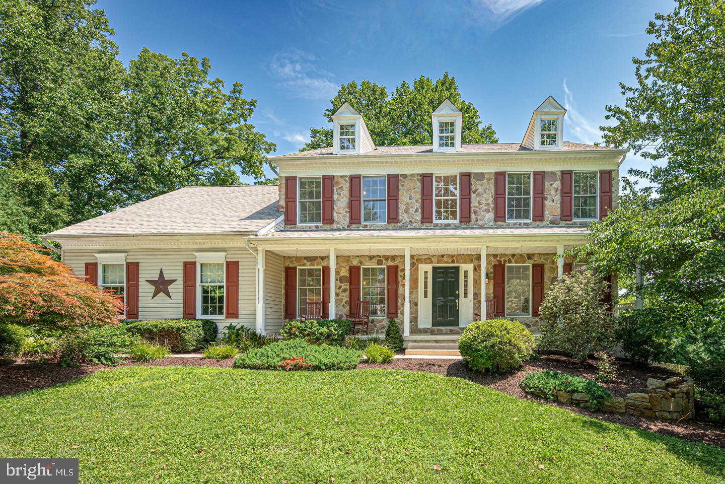 Welcome to Williamsburg, one of Chester County’s most desirable communities, ideally located within the highly regarded Downingtown Area School District. Tucked away on a quiet cul-de-sac, this freshly painted 4-bedroom, 2 full and 2 half bath stone-front Colonial combines timeless curb appeal, generous living spaces, valuable recent improvements, and an exceptional outdoor setting designed for everyday living and entertaining. Walk up to a welcoming covered front porch where you can sit on a rocking chair and enjoy any time of the day. Out back, the property truly shines with a spacious fenced yard—a coveted feature within the community—along with an oversized deck, rebuilt and replaced in 2020, a charming gazebo, stone patio and firepit area perfect for relaxing or gathering with family and friends. An expanded two-car garage provides additional storage and everyday convenience. Inside, a dramatic two-story foyer introduces a bright, open floor plan enhanced by wide-plank vinyl flooring and thoughtful architectural details. The spacious kitchen serves as the heart of the home with a large center island, Corian countertops, ceramic tile backsplash, abundant cabinetry, a built-in desk/workstation and an adjoining breakfast area filled with natural light from the skylight above. The kitchen windows and sliding glass door leading to the deck were replaced in 2023, and the skylight in the breakfast area was also replaced in 2023 in conjunction with the new roof. The formal dining room features classic chair rail and crown molding, while the light-filled living room is accented by crown molding and a large bay window. The inviting family room offers a cozy window seat and a striking stone wood-burning fireplace as its focal point. A powder room and convenient laundry/utility room complete the main level. A turned hardwood staircase leads upstairs to four generously sized bedrooms. The spacious primary suite is a relaxing retreat with a cathedral ceiling and an adjoining sitting/dressing room featuring built-in closet storage—an incredibly flexible space that could also serve beautifully as a private home office. The vaulted primary bath features a skylight, whirlpool tub, ceramic tile shower and flooring, double vanity, and linen storage. The primary bath skylight was replaced in 2023 along with the roof. Three additional bedrooms and a well-appointed hall bath complete the upper level. The finished walkout lower level adds valuable living and entertaining space with a kitchenette/wet bar, powder room and plenty of additional storage.Significant recent improvements provide added peace of mind, including a **new air conditioning unit and hot water heater installed in July 2026**, **office windows replaced in 2025**, **roof and two skylights replaced in 2023**, **kitchen windows and sliding glass door replaced in 2023**and **complete rebuilt deck that was replaced in 2020**. Williamsburg offers an exceptional community lifestyle with a clubhouse, swimming pool, playground, baseball and soccer fields, basketball court, seasonal neighborhood activities, and convenient access to the Struble Trail. Enjoy a prime Chester County location close to shopping, dining, parks, schools, public transportation, and major commuter routes including Routes 30, 202, 113 and 100, as well as the Pennsylvania Turnpike. With its sought-after cul-de-sac setting, expansive outdoor living spaces, flexible finished lower level, impressive recent improvements, and access to the highly regarded Downingtown Area School District and STEM Academy, this Williamsburg home offers an exceptional combination of location, space, comfort, and community.
