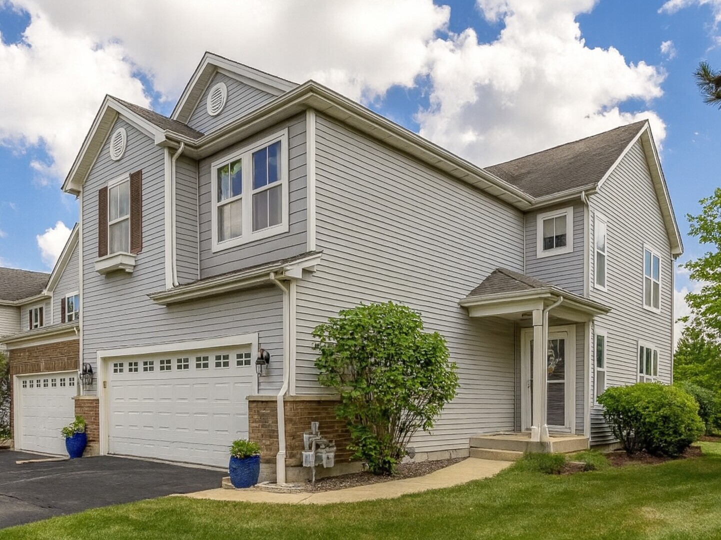 Stunning End-Unit Townhome That Lives Like a Single-Family Home!  Welcome to this beautifully updated Sterling model in the desirable Park Place community. This spacious end-unit townhome offers over 2,700 sq. ft. of finished living space, featuring 2 bedrooms, 2.5 baths, a loft, a 2-car garage, and a fully finished basement. Enjoy an open and inviting floor plan with a two-story foyer, bright family room with fireplace, and large windows along the side and back for abundant natural light. The updated kitchen includes stainless steel appliances, breakfast bar, and dining area with hardwood-style flooring throughout the main level. Upstairs, the primary suite features a walk-in closet and private bath with a soaking tub/shower combo. The second bedroom, full bath, and flexible loft area provide ideal space for guests, work, or relaxation. The finished basement includes an office space, wet bar, and recreation room with custom copper inlay ceiling and hidden storage. Step outside to enjoy your extended deck and beautifully landscaped yard. Located minutes from the Randall Road corridor, this home offers the perfect combination of space, style, and convenience. Move-in ready and sure to impress-schedule your showing today!