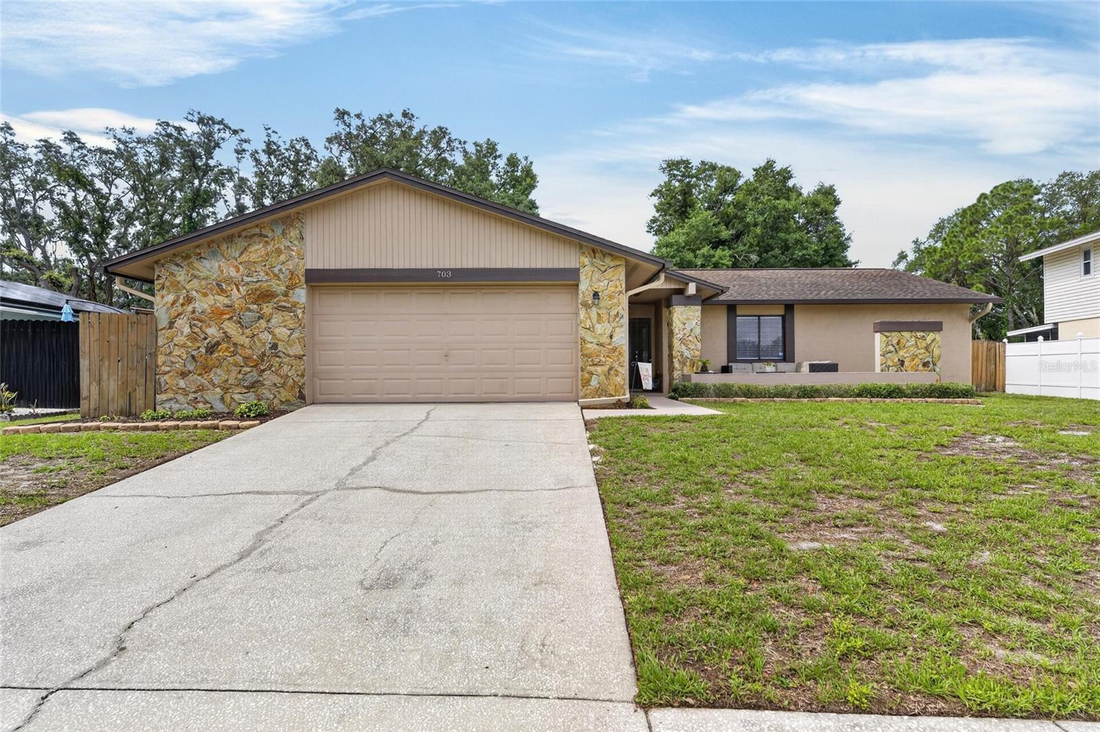 Welcome home to this beautifully maintained 3 bedroom, 2 bath, single-family residence featuring an oversized 2-car garage, ideally located in the highly sought-after Bloomingdale Community - with NO HOA and situated in Flood Zone X (no flood insurance required)! Nestled on an oversized .24-acre lot, this desirable home offers the perfect blend of comfort, thoughtful updates, and inviting outdoor living.Inside, you will find a move-in-ready interior featuring a spacious enclosed Florida room, new ceiling fans throughout, updated kitchen hardware, neutral interior paint, and popcorn ceilings removed for a clean, modern feel. The generously sized primary suite includes dual closets and an updated ensuite bath with a tiled walk-in shower. Additional improvements include a 2021 Carrier HVAC system, Updated Electrical Panel, and new carpet in all bedrooms - offering comfort and peace of mind for years to come.Step outside and enjoy a yard designed for both relaxation and entertainment, complete with a new Trex composite front deck (2023), an expansive 30' x 12'8" concrete patio (2023), vegetable and butterfly gardens, fire pit, and a fully fenced yard. The 12' x 12' shed with electricity provides excellent storage, workshop, or hobby space and features a new shingle roof and concrete entry pad. Additional exterior upgrades include new gutters (2021), leaf guards (2023), grandfather oak removal and stump grinding (2026), garage door spring replacement with stabilizers added (2026), and a Roof Replacement (2013).Location truly matters! Ideally situated just minutes from the Bloomingdale Golfers Club, Campo Family YMCA, and the Bloomingdale Sports Complex, this home is close to top-rated schools, dining, shopping, medical facilities, and everyday conveniences. Nearby, enjoy the amenities of Bloomingdale West Park, featuring basketball, tennis, racquetball, and volleyball courts, paved walking trails, and a large playground.Major Updates Include: Roof (2013) • HVAC (2021) • Electrical Panel (2021) • Water Heater (2019) • Gutters (2021) • Ceiling Fans (2023) • Extensive Outdoor Improvements (2023–2026)  Included with the sale: a comprehensive home warranty through First American Home Warranty.  Schedule your showing today!