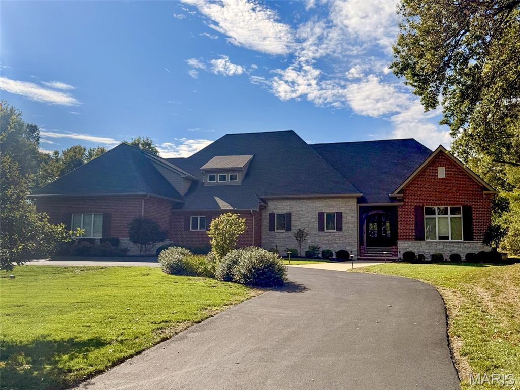 Spectacular 1.5-story, custom-built home by the Award-Winning, Luxury Home Builder Jeffrey Homes, featuring 5 bedrooms - 5 full & 1 half baths, with almost 6500 sqft of living space, is situated on a very private & beautiful 1-acre lot, in the heart of Creve Coeur – Top Rated - Parkway School District. From the moment you drive up, you will be in awe!! Once you walk through the handcrafted, solid wood front, you will be speechless. This property has been beautifully maintained, and is painted in stylish neutral colors, making it truly move-in ready. The main floor boasts an extremely functional, open floor plan, designed for today’s living and entertaining, and features a grand foyer with deep coffered ceiling, opening on the right to a stunning a vaulted great room, with beamed ceiling, floor to ceiling stone fireplace (gas), flanked by large windows, and elegant formal dining area, and to the left a gorgeous gourmet eat-in kitchen, that is any chef’s dream, with an abundance of custom cabinetry, top-tier, granite countertops, contrasting color center island / breakfast bar, top of the line appliances, including gas cooktop, custom hood, double ovens & commercial size fridge, and walk-in pantry, opening to stunning hearth room, with stone fireplace (gas), again flanked by large windows, both spaces with an incredible, custom, box beamed ceiling with contrasting colors, a fabulous main floor laundry room with custom cabinetry & sink, and a mud room with built-in lockers. If that is not enough, there is a master retreat designed to perfection, with deep coffered ceiling & custom moldings, his & her walk-in closets, and a spa-like luxury bath, with huge walk-in, multi-head. Custom tiled shower, a designer soaking tub, and his & her vanities with granite countertops, a 2nd bedroom en-suite, with its own full bath & walk-in closet, and a lovely powder room, completing the 1st floor. Walk up the stunning handmade staircase with custom iron balusters to 2nd floor featuring 2 additional bedrooms, both en-suite with their own full baths, and walk-in closets. The professionally finished level (deep pour) is terrific with over 1900 sqft of finished space, including with huge rec room with multiple seating areas, a wonderful fitness room, the 5th legal bedrooms, the 5th full bath, and a multipurpose bonus room, currently used as a home office, still leaving plenty of unfinished storage. Additional features include, 10’ plus ceilings, zoned HVAC, gorgeous, engineered hardwood flooring throughout, extensive millwork & moldings, high-end lighting fixtures, custom window treatments, irrigation system, professional landscaping, circular driveway, and oversized, 3-car garage, side-entry, just to name a few. Relax outside on the expansive, concrete patio, overlooking your beautiful private backyard, where there is more than enough space to add an in-ground pool, still leaving plenty of green space. This home is perfect for entertaining family & friends, and the location could not better, near three major hospitals, shopping, restaurants, county parks and close by to many of St. Louis’s finest private schools, including MICDS, CBC, DeSmet, Chaminade, Whitfield, Westminster, Villa Duchesne and Visitation Academy high schools – easy access to major highways.