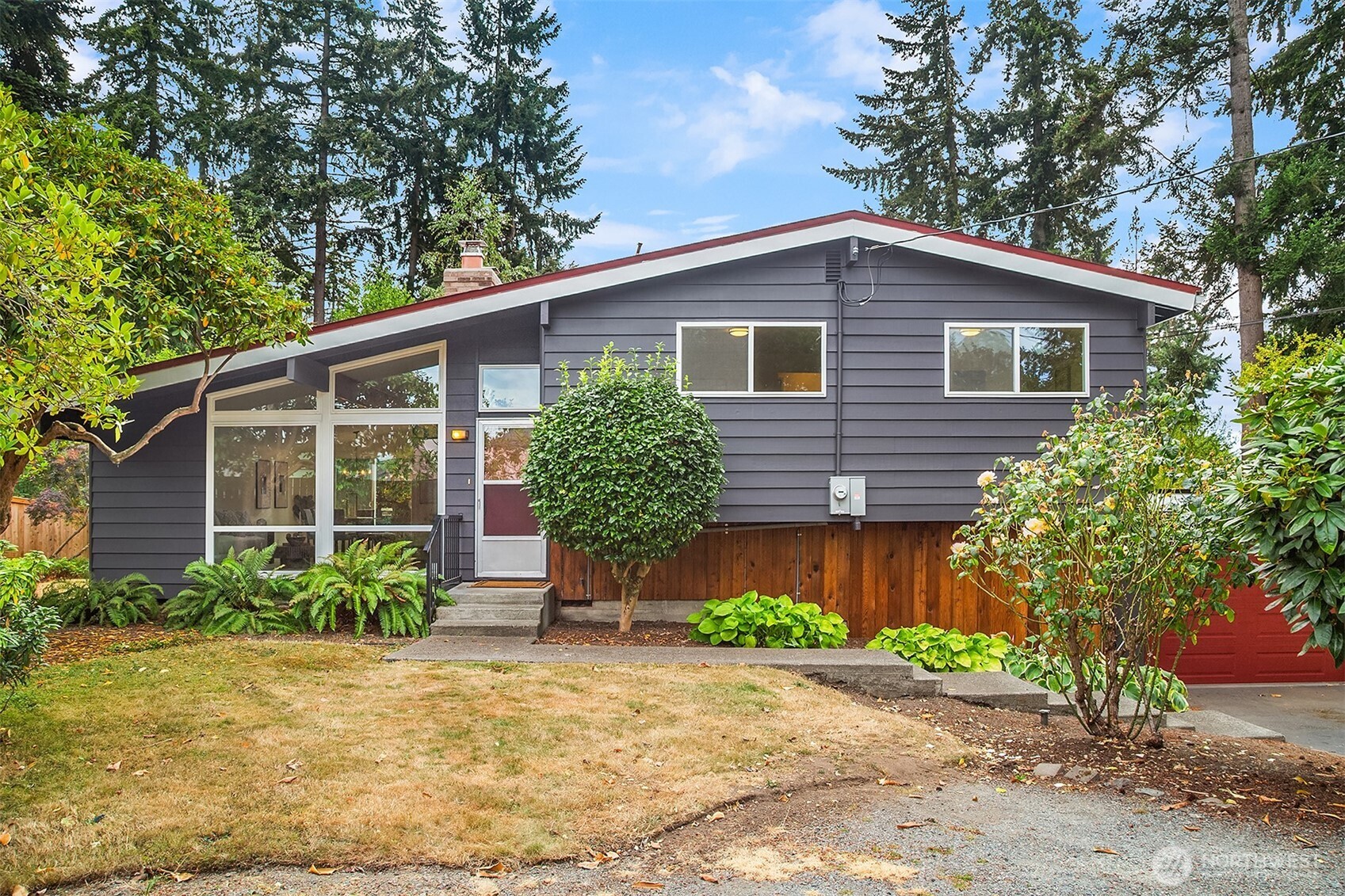 Located at the end of a quiet cul-de-sac, this well-maintained mid-century home is filled with character and warmth. Just a short stroll to Five Corners, enjoy morning coffee nearby or wander over for dinner at some of the area’s most popular restaurants. The sliding door off the dining room opens to a custom patio overlooking an oversized, sun-filled backyard, a perfect setting to play, relax, entertain, or start the garden of your dreams. Inside, vaulted ceilings and expansive windows fill the living room with natural light, creating a calming sense of space while maintaining a peaceful connection to the outdoors. Recently painted inside and out, the home feels fresh and ready for its next chapter. Downstairs, the versatile family room offers a comfortable place to unwind and separate from the main living spaces, while also working beautifully as a playroom, home office, fitness area, or creative space. The attached garage includes a generous workshop with plenty of room for tools, toys, hobbies, and projects.