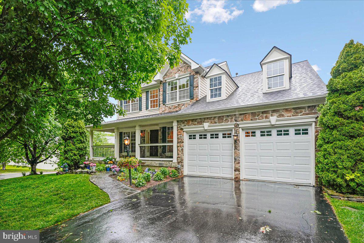 Welcome home to this beautiful Colonial situated on a premium quarter-acre lot in the heart of Purcellville. Featuring 5 bedrooms, 3.5 bathrooms, and nearly 4000 finished square feet across three beautifully finished levels, this exceptional home combines timeless charm with thoughtful updates throughout. A stunning stone walkway leads to a gorgeous full length stone porch, perfect place to relax and unwind any time of day.  Step inside the impressive two-story foyer where you'll find manufactured hardwood floors and custom paint throughout the marvelous main level add elegance and lovely detail.   The elegant formal living  offers crown molding and the dining room is enhanced with crown, chair, and picture molding details. The beautifully appointed gourmet kitchen features plentiful cabinetry, granite countertops, center island with propane gas cooktop, updated appliances including double wall oven,  walk-in pantry, built-in desk space, and an adjoining breakfast room with French doors leading to the custom deck overlooking the fenced rear yard.The spacious family room offers crown molding, recessed lighting, ceiling fan, and a cozy stone-hearth propane gas fireplace. A private main-level office/den/study with crown molding provides the ideal work-from-home space. The main level is completed by a stylish half bath with pedestal sink and a functional mudroom with washer and dryer, cabinet storage, closet space, and access to the oversized two-car garage featuring custom painted flooring .Hardwood stairs lead to the upper level with upgraded carpeting throughout. The luxurious primary suite features a vaulted ceiling w/ ceiling fan, two spacious walk-in closets, and lux bath with double vanity, tile flooring, corner jetted tub, and separate shower. Three additional upper-level bedrooms offer generous closet space, custom paint, and ceiling fans. The updated hall bath includes tile flooring, updated vanity, and tub/shower combination.The fully finished walkout lower level is designed for entertaining and flexible living with luxury vinyl plank flooring, recessed lighting, and custom paint.  The expansive recreation room is ready for relaxing, game days, and movie nights. The fifth bedroom includes two full windows and custom paint, while the third full bathroom features an updated vanity and tub/shower combination. A versatile bonus room with oversized walk-in closet and recessed lighting is perfect for a home office, gym, craft room, playroom, or additional storage. Double French doors provide access to the expansive and fenced rear yard.Enjoy all that Purcellville and Western Loudoun have to offer, including charming small businesses, farm-to-table restaurants, wineries, breweries, scenic farms, and outdoor recreation. Conveniently located near the W&OD Trail, Bush Tabernacle Skating Rink, Fireman’s Field, and the Franklin Park Arts Center, this home offers the perfect blend of comfort, convenience, and community. Truly, there is no place like home.