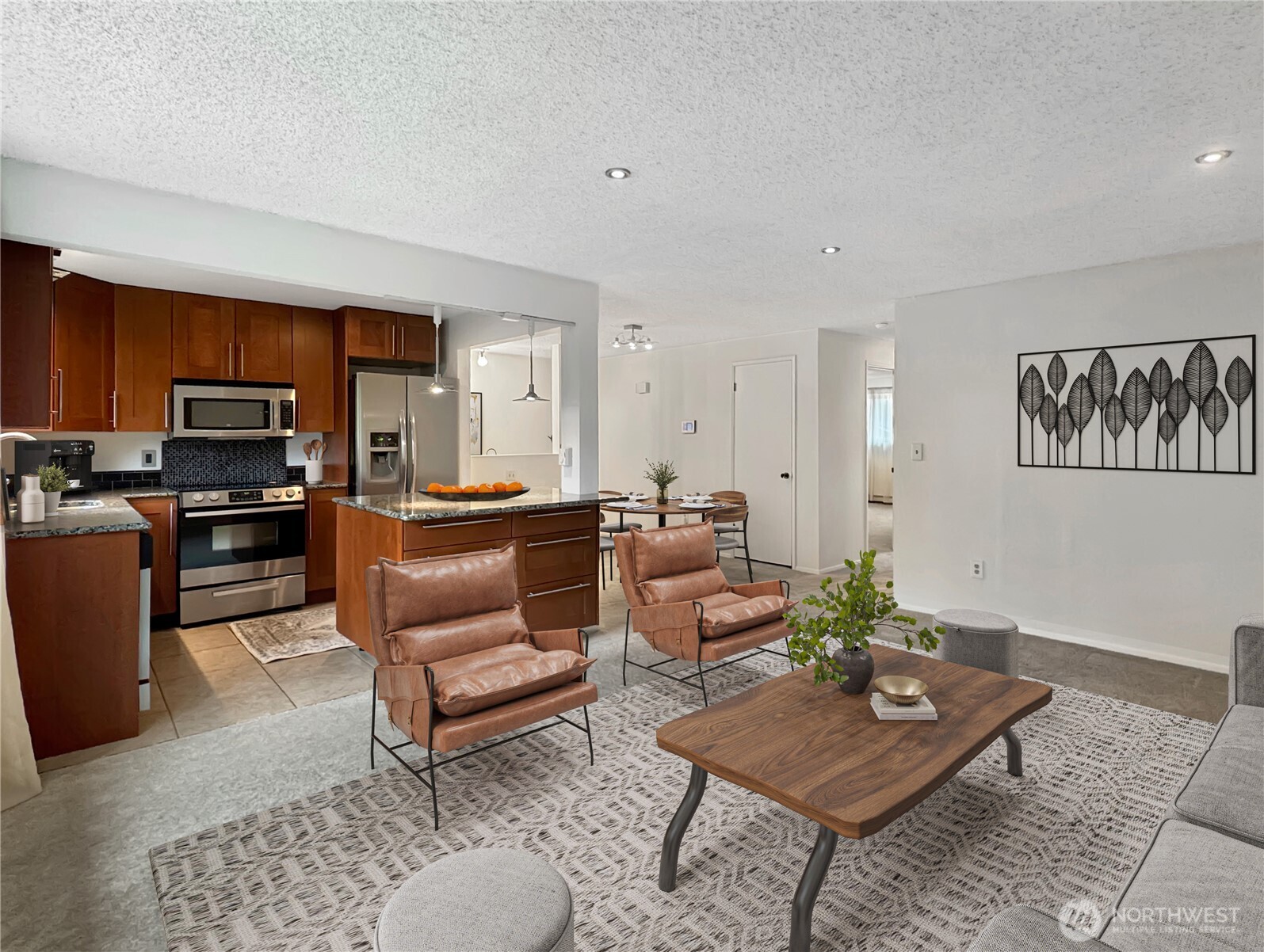 FHA/VA APPROVED Complex! Spacious and updated top-floor condo offering a private, peaceful setting overlooking the community courtyard. Features a REMODELED KITCHEN with granite counters, tile flooring, stylish cabinetry, and stainless-steel appliances. Open great-room design with fresh paint, large primary bedroom with dual closets, double-pane windows, newer roof and plumbing, full bath plus half bath with laundry. All appliances stay. Conveniently located near bus lines, light rail, freeways, hospitals, schools, restaurants, shopping, and downtown Edmonds! NO RENTAL CAP