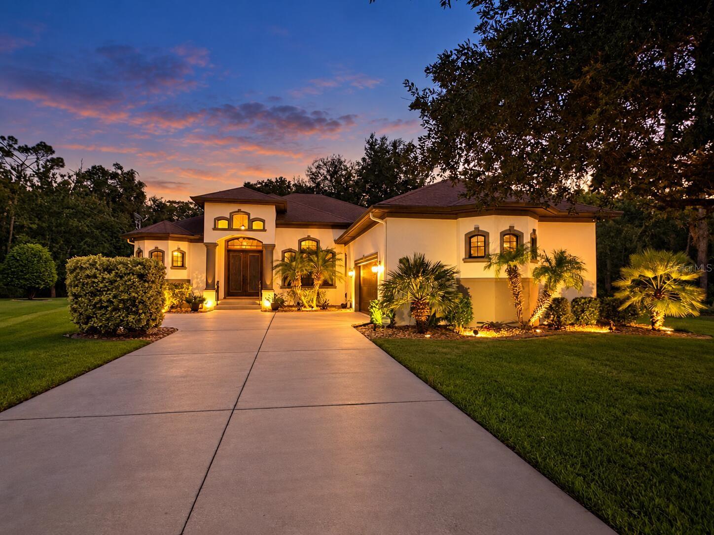 Welcome to 30 Egret Trail, a beautifully maintained custom-built home nestled in the desirable Cypress Knolls community. This exceptional 4-bedroom, 2-bath block home features 2,330 square feet of thoughtfully designed living space, a screened saltwater pool, and an inviting blend of comfort, quality, and Florida living.Surrounded by natural beauty, the property backs to a mature wooded buffer, creating a peaceful setting with no neighboring homes directly behind or to the right.Step inside to discover soaring, elegant tray ceilings, custom architectural details, and oversized windows that fill the home with natural light. Two spacious living areas provide the perfect balance of comfort and versatility for both everyday living and entertaining.At the heart of the home, the beautifully appointed kitchen features granite countertops, abundant cabinetry, a center island, and an open flow into the family room and covered lanai. Whether hosting gatherings or enjoying a quiet evening at home, the layout creates effortless indoor-outdoor living.The spacious primary suite serves as a relaxing retreat, complete with dual vanities, a soaking tub, separate walk-in shower, and generous walk-in closets. Three additional bedrooms provide flexibility for guests, a home office, or other needs. One bedroom features a custom built-in queen-sized loft bed, adding both character and functionality.Step outside and embrace the Florida lifestyle. The screened saltwater pool and expansive covered lanai create an inviting setting for year-round relaxation, outdoor dining, and entertaining. The fully fenced backyard includes a separately enclosed dog run with added screening, thoughtfully designed to provide pets with a secure outdoor space and an additional barrier from local wildlife. A dedicated 10' x 12' shed pad is already in place, providing a convenient foundation for future storage or workshop possibilities.Completing the property is an oversized 2.5-car garage with ample room for vehicles, recreational equipment, and additional storage.With custom architectural details, a spacious layout, exceptional outdoor living areas, and beautiful natural surroundings, 30 Egret Trail presents a distinctive opportunity to enjoy the best of Florida living. Beautifully maintained and move-in ready, this Cypress Knolls home combines comfort, functionality, and a setting that's increasingly hard to find.