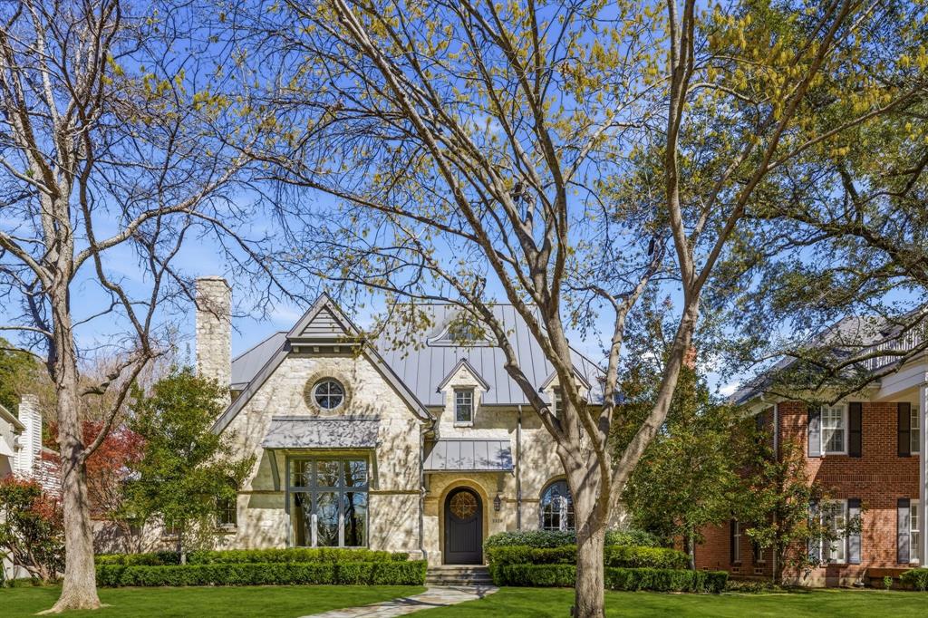 Beautifully crafted University Park residence set on a 70x160 lot, built by renowned builder Rusty Goff and meticulously maintained throughout. Spanning 6,320 square feet, this home showcases timeless architecture with a hand-chiseled stone exterior, antique wood floors and beams, and a dramatic living room anchored by a soaring 20-foot cathedral ceiling.The first floor offers gracious formal living and dining spaces, a private study, spacious family room, and a chef’s kitchen complete with premium appliances, butler’s pantry, and walk-in pantry—designed for both everyday living and effortless entertaining.Upstairs features three ensuite bedrooms, a game room, and an impressive primary suite with vaulted ceilings, dual walk-in closets, and a newly remodeled marble bath with a dedicated coffee bar.A third-floor loft provides approximately 331 square feet of flexible bonus space.The private backyard is a true retreat, complete with a screened porch, outdoor kitchen, and a resort-style pool and spa.Ideally located just a short walk to UP Elementary and minutes from the dining and shops of Snider Plaza, this home offers the perfect blend of timeless design and everyday convenience.