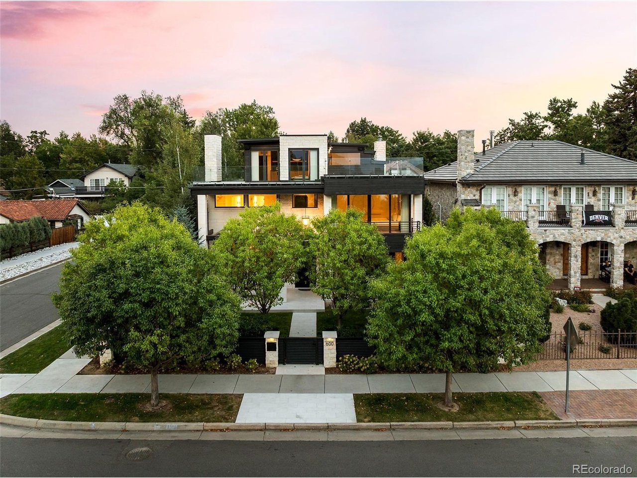 A NEW LOOK. A NEW PRICE. AN EXTRAORDINARY OPPORTUNITY IN WASH PARK.Reintroduced to the market with a fresh new look and compelling new price, this exceptional residence has just completed a total renovation by award-winning Boss Architecture-offering a rare opportunity to own one of Washington Park's most remarkable homes.Wake each morning to unobstructed, cinematic views stretching across Smith Lake at Washington Park to the Rocky Mountains beyond. Perfectly positioned to capture some of the finest vantage points in Wash Park, the home offers breathtaking views from all three levels.Thoughtfully reimagined from the ground up, the residence has undergone a complete interior and exterior transformation by Boss Architecture, where impeccable craftsmanship meets refined, timeless design. No detail has been overlooked. Designer lighting, top-of-the-line appliances, a private elevator, attached three-car garage, and a Bravas smart home system utilizing Control4-fully customizable and paired with a state-of-the-art security system-create an exceptional living experience.The outdoor spaces are equally compelling. A beautifully landscaped backyard features a saltwater pool, fountain, and outdoor grill, creating an inviting setting for both intimate evenings and elegant entertaining. Above it all, a spectacular rooftop oasis provides an unforgettable retreat for sunset gatherings, framed by sweeping lake and mountain views.Freshly reintroduced and newly priced, this is a rare opportunity to experience an irreplaceable residence in one of Denver's most coveted settings.