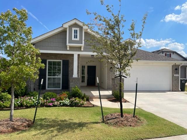 STUNNING 3 bedroom home in the Greenleaf Trails community in NE Norman. Amazing curb appeal with large fenced backyard, terraced landscaping off the covered back patio.  Open floor design with HUGE entryway.  Secondary bedrooms to the front of the home.  Master suite tucked away in the back off the living area featuring double vanities with step in shower and walk in closet.  Wood look tile throughout the main living areas with carpet in the 3 bedrooms.  Bright white kitchen cabinets with corner pantry and coffee niche next to the  island overlooking the living area. Mud bench at the garage entry with separate utility room.  Home is nestled in a quiet cul-de-sac with access to many of the HOA amenities for your enjoyment - walking trails, fishing ponds, playgrounds, splash pad, sports fields, basketball court and butterfly gardens throughout.