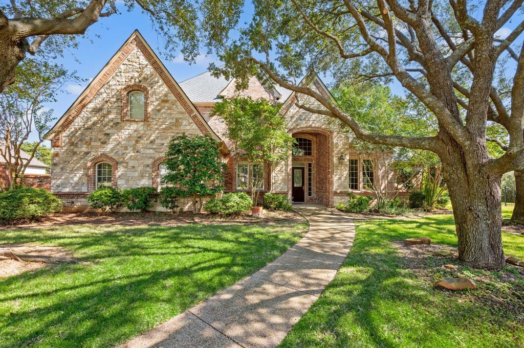 Elegant Home in the Gated Community of Shalimar! Set on nearly half an acre backing to the scenic Colleyville Cotton Belt Trail, this charming residence offers both privacy and natural beauty—no rear neighbors in sight. Inside, soaring ceilings and rich hardwood floors create an inviting, open atmosphere. A private office with French doors and a custom built-in desk provides the perfect space for work or study. From the entryway, enjoy clear sight lines to expansive windows that fill the home with natural light and showcase serene backyard views. The gourmet kitchen features granite countertops, a gas cooktop, double ovens, a center island, breakfast bar seating, and a spacious pantry—ideal for both everyday living and entertaining. The adjoining living room centers around a stunning stone gas fireplace, adding warmth and sophistication. The primary suite on the main level offers a luxurious retreat with a jetted tub and a custom-designed closet. Two additional bedrooms and a powder bath complete the downstairs layout. Upstairs, a large game room with a wet bar and an adjacent media room create an entertainer’s dream. Two more bedrooms and a full bath provide comfort and flexibility for family or guests. Outdoors, the expansive backyard features a covered patio and abundant space to design your dream pool or garden oasis. Conveniently located between Dallas and Fort Worth, minutes from the Dallas Fort Worth International Airport. Nearby Southlake Town Square and Historic Downtown Grapevine offer a multitude of shopping and dining options!