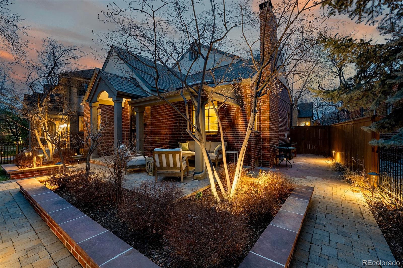 This classic brick 2 story home is located just one block from Bonnie Brae Park, and evokes charm and grace. The open floor plan creates an effortless flow between rooms, providing natural light that highlights the character and thoughtful updates throughout. The gourmet kitchen has a Dacor six-burner range, Miele dishwasher, Thermador cabinet depth/paneled refrigerator, slab countertops and custom cabinetry. 3 beds up and 1 on the main with a second family room in the basement along with a custom office and gym area. The professionally landscaped yard is xeriscaped with a large deck and gorgeous tree covering to provide a low maintenance entertainment area and al fresco dinging. The main level bedroom would make a great guest bedroom or office, and the exercisoe room can be converted to a guest bedroom in the basement with a 3/4 bath. Located on a quiet tree lined street and walking distance to all Bonnie Brae has to offer, this property is a truly well loved and classy home.