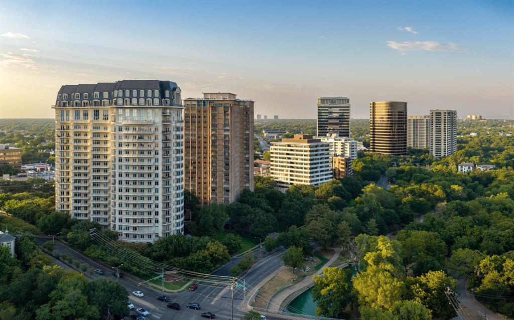 Penthouse 18C at The Vendome offers a rare opportunity to experience two-level penthouse living high above Turtle Creek, it brings a decidedly modern point of view to one of Turtle Creek’s most distinguished addresses Spanning 6,638 square feet, the four-bedroom residence was extensively renovated in 2024, pairing exceptional scale and sweeping Dallas skyline views with sophisticated finishes and an abundance of natural light throughout. Direct elevator access to a private corridor on both levels creates a remarkable sense of privacy and arrival. Rich walnut floors connect expansive living and entertaining spaces, while a gallery wall paneled in rare African Sapele mahogany provides a dramatic architectural moment. The beautifully appointed kitchen is anchored by Calacatta Macchia Vecchia marble, complemented by striking natural stone selections throughout the residence. Multiple living areas, two wet bars, two generous terraces and a 2,200-bottle wine room create an exceptional setting for entertaining. The serene primary suite captures spectacular skyline views and features a completely redesigned bath wrapped in dramatic Aranescato Corchia marble with separate soaking tub and shower as well as an extraordinary closet. Phillip Jeffries wallcoverings, Brizo fixtures and integrated Crestron and Lutron technology further elevate the interiors. Four premier parking spaces and two storage units complete this exceptional offering. Residents of The Vendome enjoy 24-hour valet and concierge, resort-style pool with cabanas, fitness center, owner’s library, entertaining room and dog park